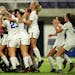 Minnetonka players mobbed their goalkeeper Paige Kahlmeyer (0) while they celebrated the win over Wayzata as time expired in the second half.