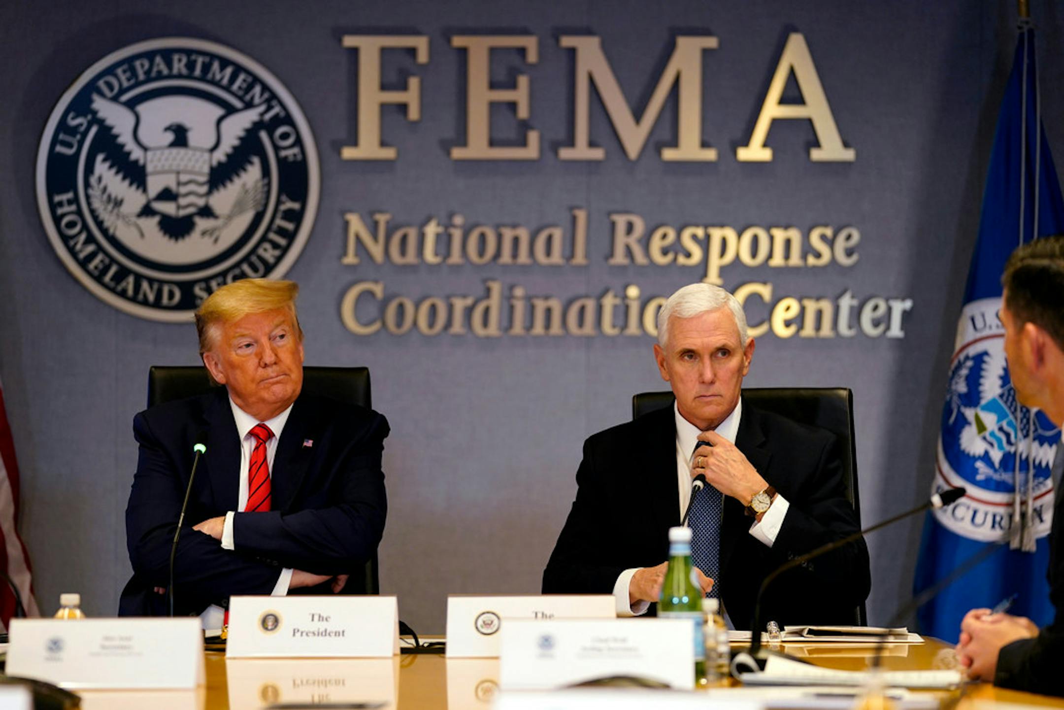 President Donald Trump and Vice President Mike Pence attend a teleconference with governors at the Federal Emergency Management Agency headquarters, Thursday, March 19, 2020, in Washington.
