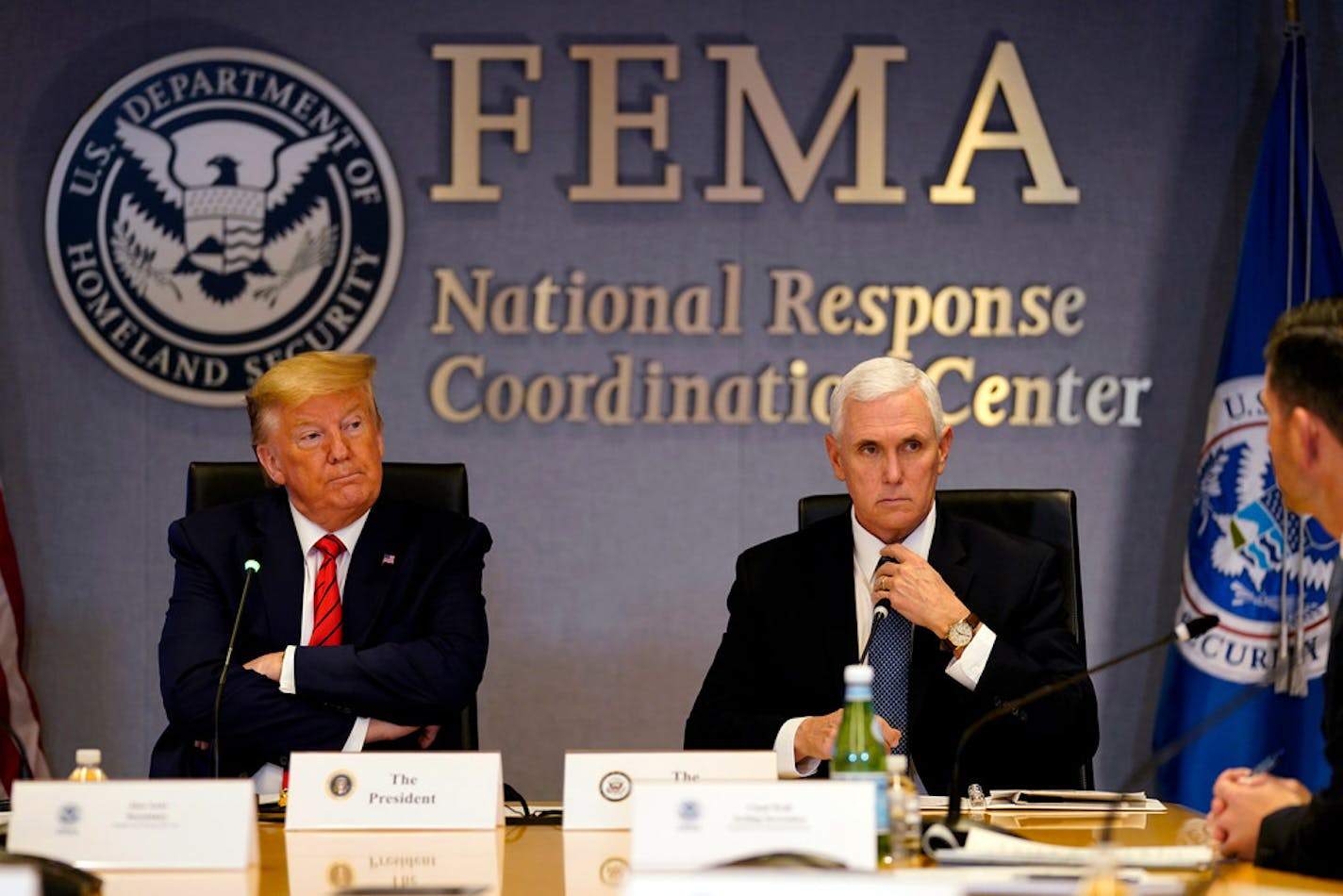 President Donald Trump and Vice President Mike Pence attend a teleconference with governors at the Federal Emergency Management Agency headquarters, Thursday, March 19, 2020, in Washington.