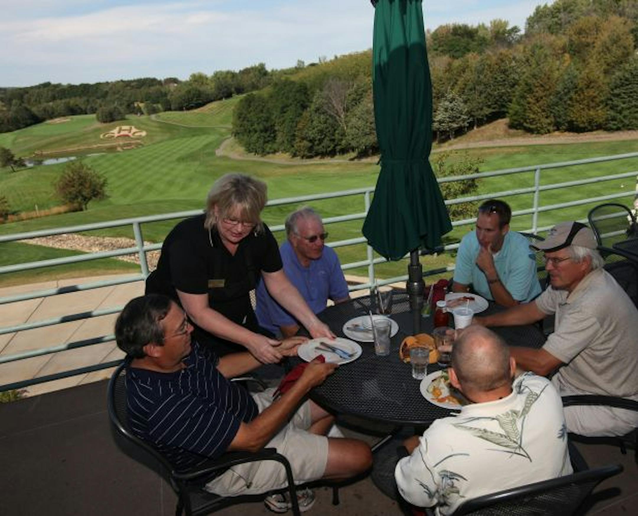 From left, Alan Burchill, Becky Koepke, Duwyane Bakke, Brett Bakke, Jay Griggs, and Jim Kudrle, facing away from camera