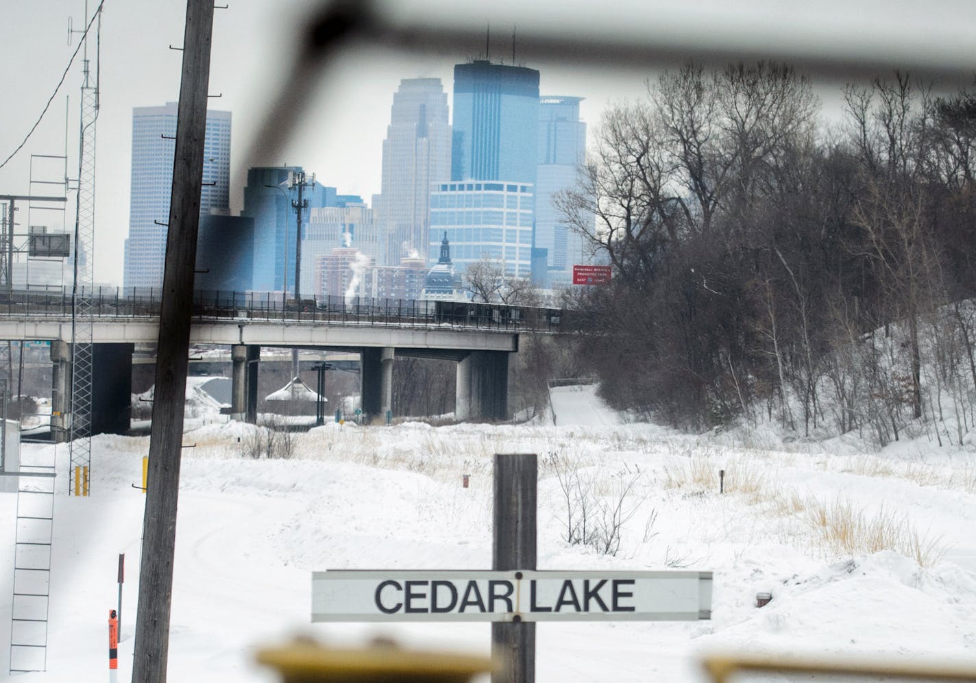 9:13 a.m. The train paused at Cedar Lake Ave. awaiting permission to proceed into Minneapolis. ] GLEN STUBBE * gstubbe@startribune.com Tuesday March 4, 2014. It's the small railroad that has caused big headaches for planners of the Southwest Corridor light rail. The Twin Cities & Western hauls corn, soybeans and ethanol from rural Minnesota to St. Paul, and is leery about moving its line to make room for the future light rail. We ride along on the little railroad with oversized clout in the cont