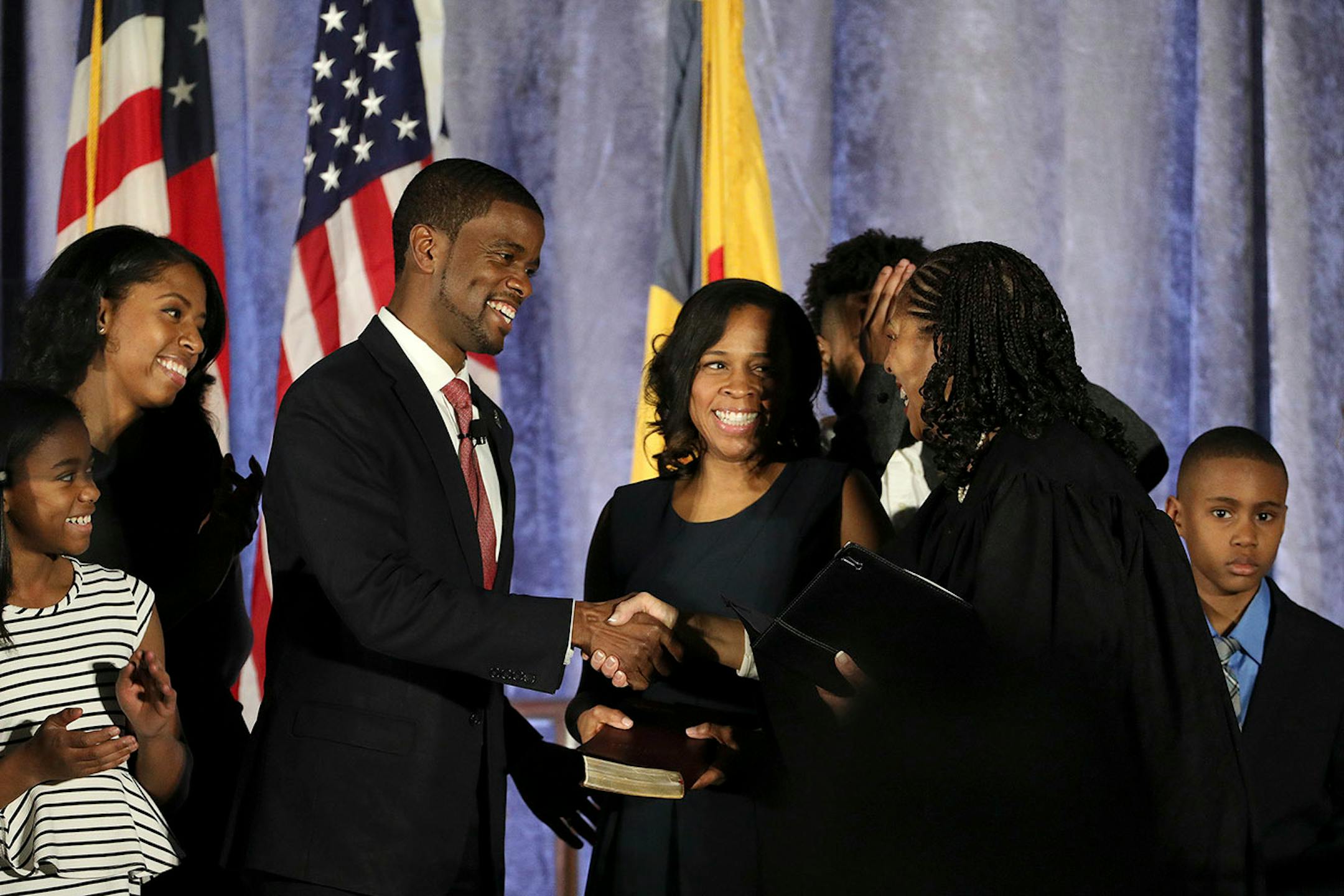 Melvin Carter and his wife Sakeena Carter were joined on stage by their family as Justice Tanya Bransford with the Fourth Judicial District administered the oath of office during Carter's swearing in ceremony as St. Paul mayor.