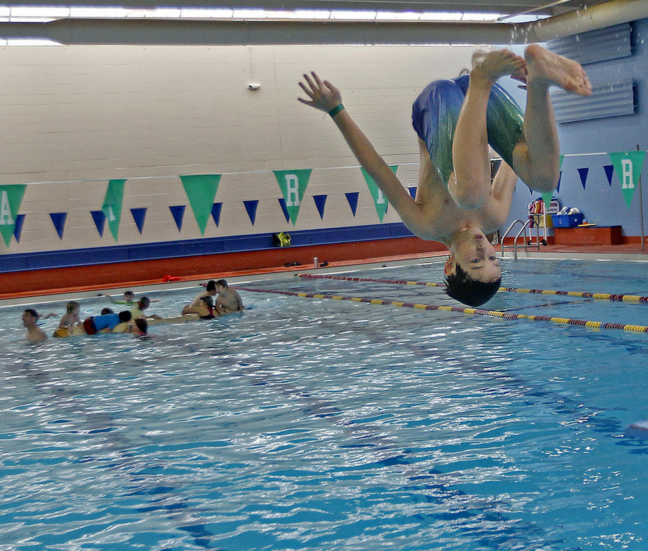 Ian Matenaer, 10, took a plunge inside the pool at Oxford/Jimmy Lee Community Center, Monday, January 27, 2014 in St. Paul, MN. He would normally be going to school at Randolph Heights Elementary School. The pool opened extended hours to accommodate students due to school closures. (ELIZABETH FLORES/STAR TRIBUNE) ELIZABETH FLORES &#x2022; eflores@startribune.com