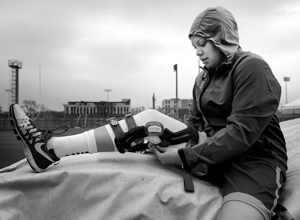 Rachel Banham adjusted her knee brace before a running workout on April 23, 2015. Banham was cleared to run for the first time earlier that week after
