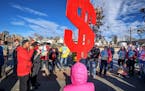 Supporters of the $15 minimum wage for St. Paul rallied in front of Walmart in the Midway area of St. Paul Friday morning.