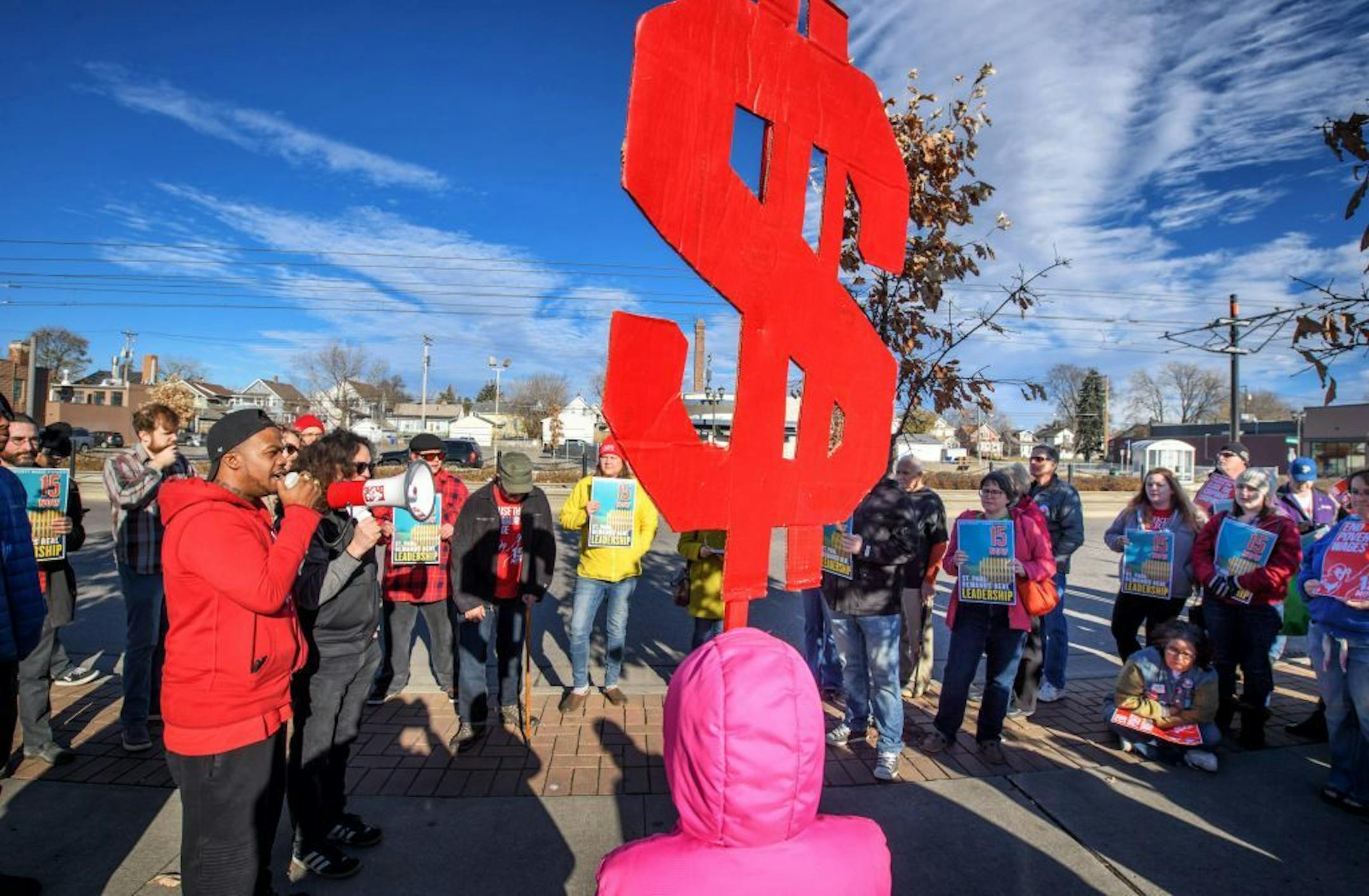 Supporters of the $15 minimum wage for St. Paul rallied in front of Walmart in the Midway area of St. Paul Friday morning.