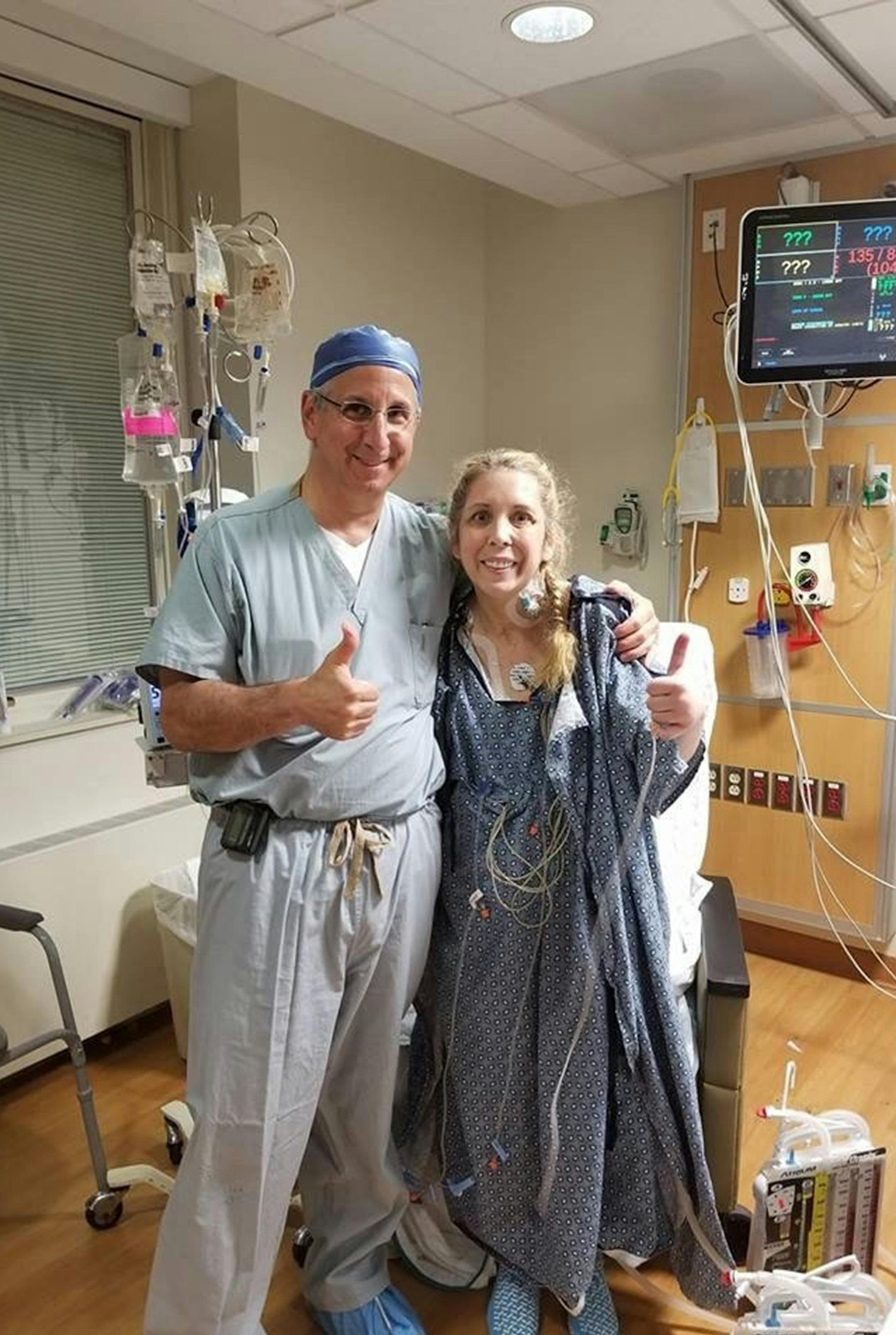 Kelly Asbell, after double lung transplant surgery, with her her surgeon, Dr. Jeffrey Schwartz, at Loyola University Medical Center. (Courtesy of Kelly Asbell)