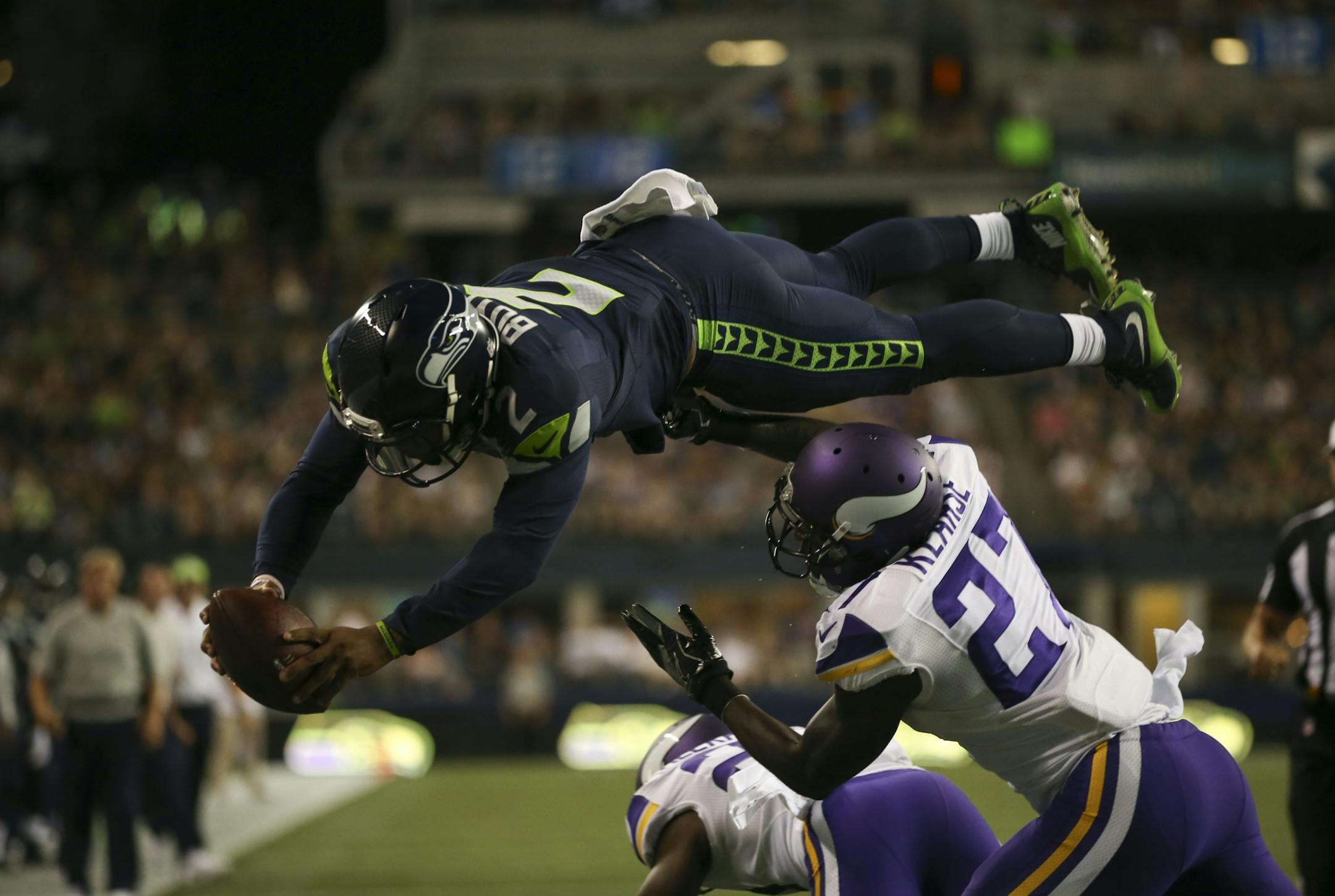 Seattle Seahawks quarterback Trevone Boykin (2) dove into the endzone over Vikings safety Jayron Kearse (27) for a two point conversion after a touchdown in the fourth quarter Thursday night.