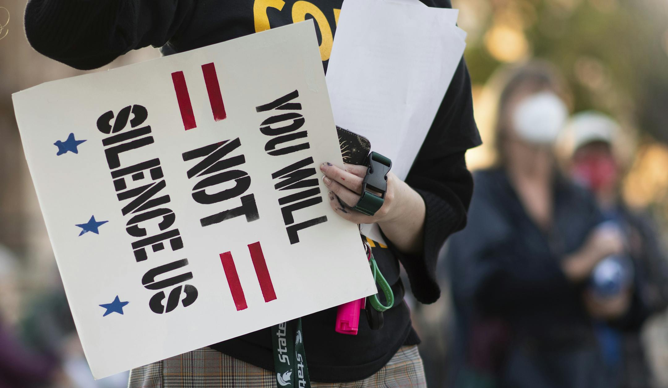 People gather at the Michigan State Capitol in downtown Lansing, Mich. Wednesday, Nov. 4, 2020, one day after the Nov. 3 election. Organized by The Sunrise Movement, Indivisible Michigan, the Greater Lansing Democratic Socialists of America, and We the Free People. They are demanding a peaceful transition of power and that all votes are counted. (Matthew Dae Smith/Lansing State Journal via AP)