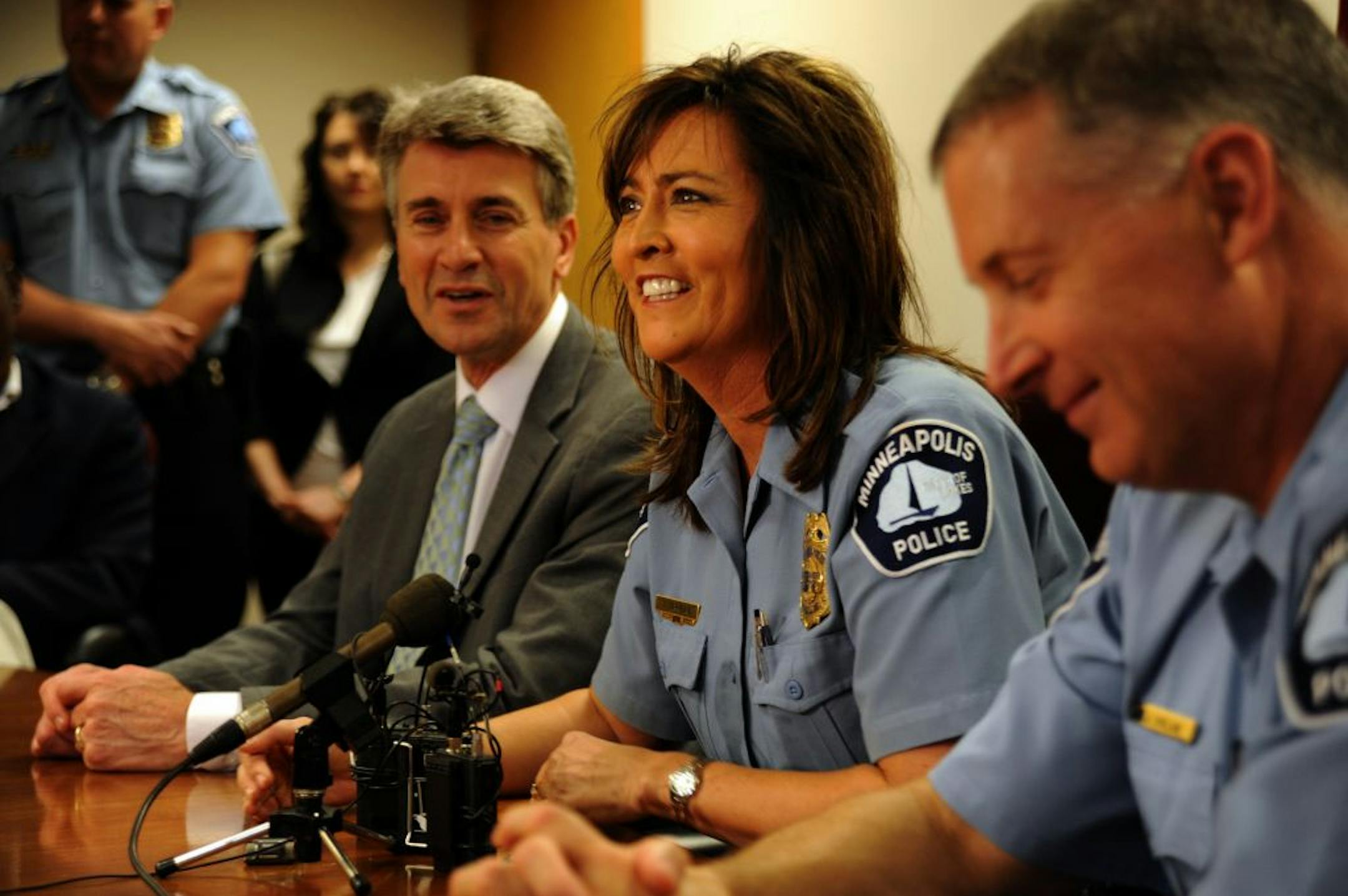 Janeé Harteau is flanked by Mayor R.T. Rybak and Minneapolis Police Chief Tim Dolan Thursday as Rybak formally announced her nomination to be the next chief.
