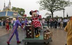 A Disney character takes part in a parade on the eve of the opening of the Disney Resorts in Shanghai, China, Wednesday, June 15, 2016. The debut of S