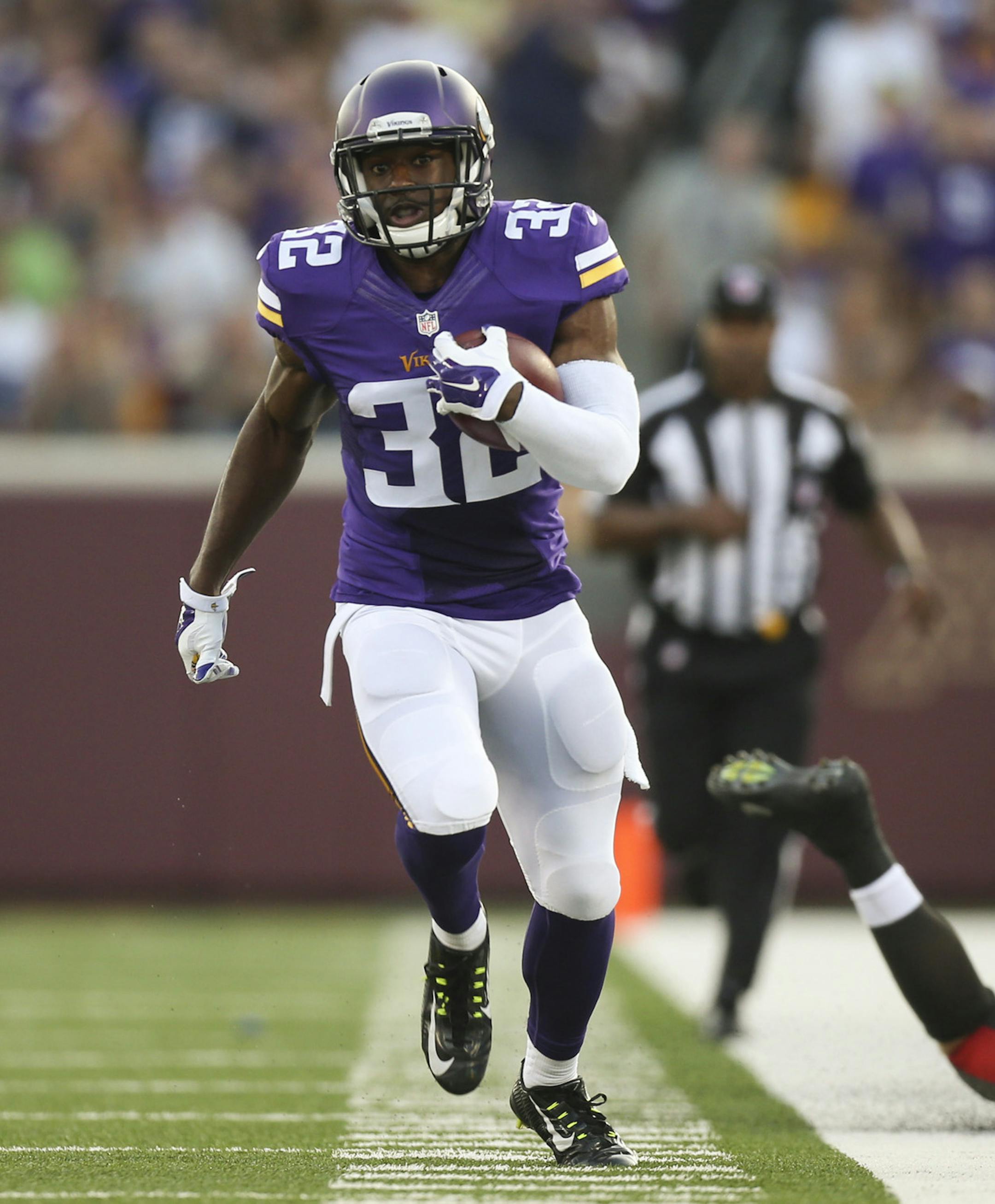 Vikings cornerback Antone Exum (32) headed down the sideline for a 34 yard gain after intercepting a second quarter Tampa Bay pass at TCF Bank Stadium Saturday night. ] JEFF WHEELER ï jeff.wheeler@startribune.com The Minnesota Vikings played their first home preseason game against the Tampa Bay Buccaneers Saturday night at TCF Bank Stadium in Minneapolis.
