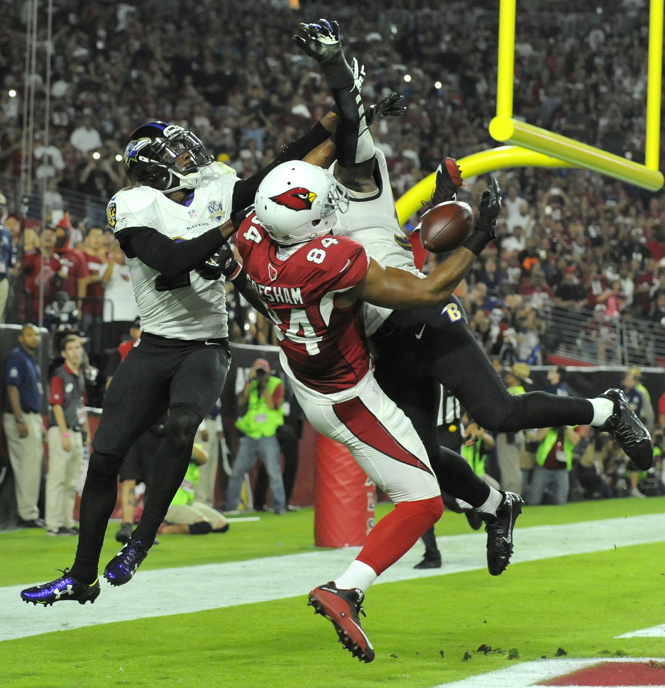 Baltimore Ravens' Brynden Trawick and C.J. Mosely defend Arizona Cardinals' Jermaine Gresham, but the Ravens are called for pass interference on Monday, Oct. 26, 2015, at the University of Phoenix Stadium in Glendale, Ariz. (Lloyd Fox/Baltimore Sun/TNS)