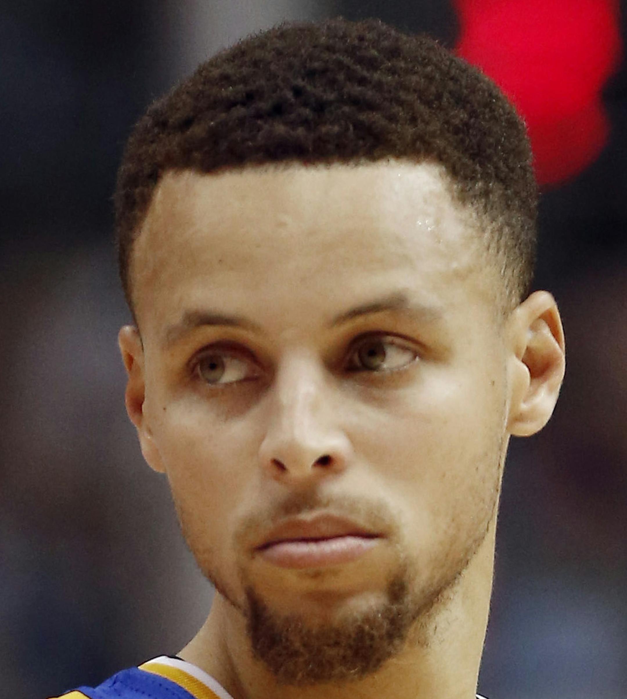 Golden State Warriors guard Stephen Curry (30) looks on during the first half of an NBA basketball game against the Dallas Mavericks Friday, March 18, 2016, in Dallas. Golden State won 130-112. (AP Photo/Brandon Wade)