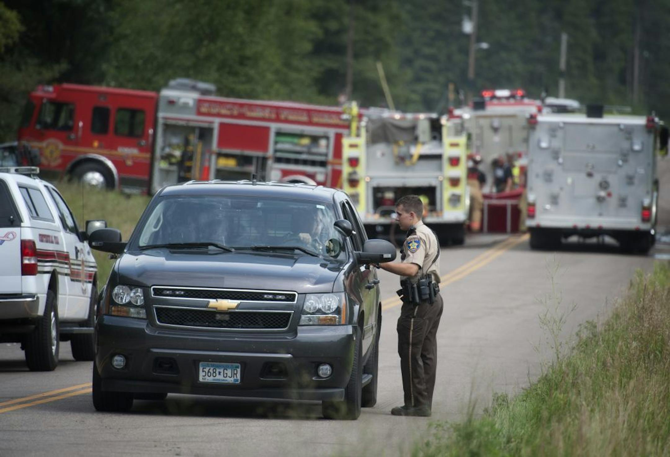 Anoka County Sheriff's Deputy M. Nolan controlled traffic down the street from a fatal fire early Wednesday morning.