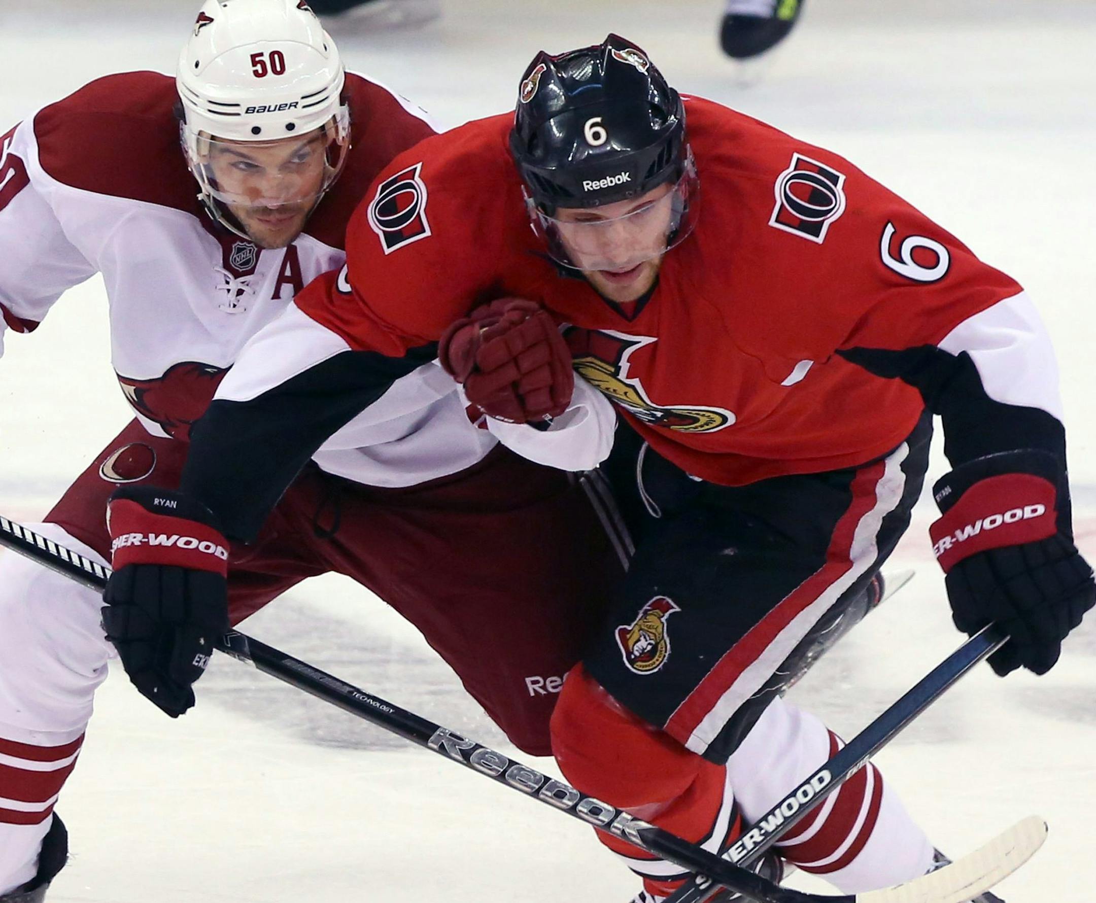 Ottawa Senators' Bobby Ryan (6) is checked by Phoenix Coyotes' Antione Vermette (50) during the first period of an NHL hockey game Saturday, Dec. 21, 2013, in Ottawa, Ontario. (AP Photo/The Canadian Press, Fred Chartrand) ORG XMIT: FXC103