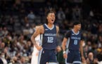 Memphis Grizzlies guard Ja Morant (12) celebrates in the second half of an NBA basketball game against the Los Angeles Clippers, Thursday, Nov. 18, 20