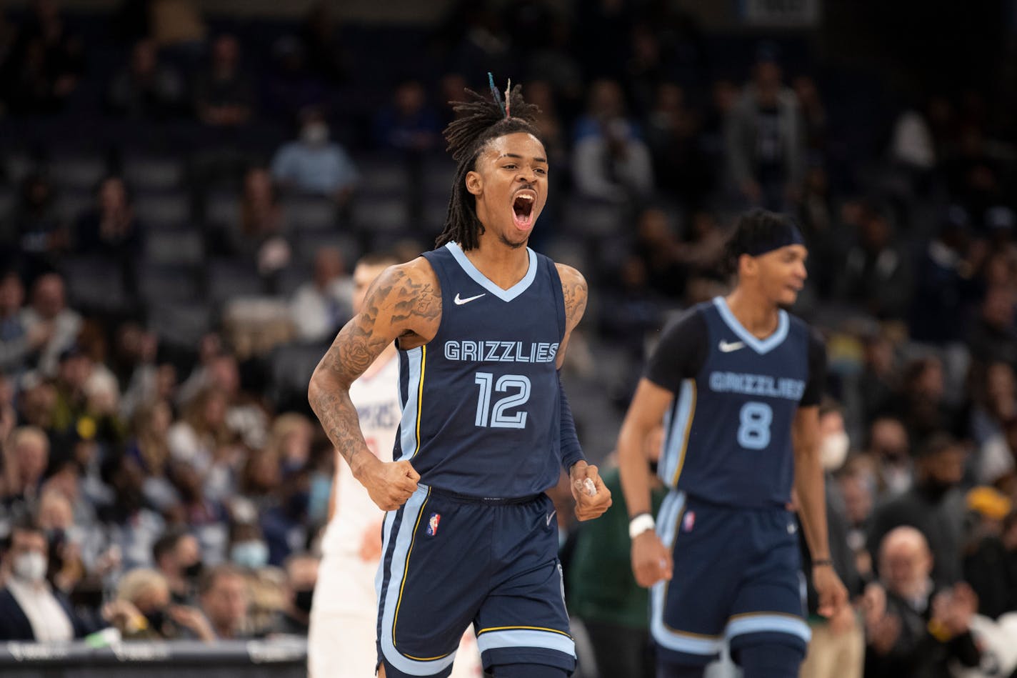 Memphis Grizzlies guard Ja Morant (12) celebrates in the second half of an NBA basketball game against the Los Angeles Clippers, Thursday, Nov. 18, 2021, in Memphis, Tenn. (AP Photo/Nikki Boertman)