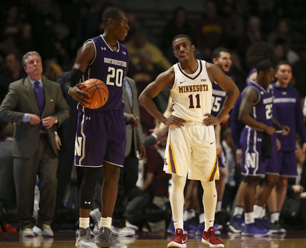 Gophers guard Isaiah Washington (11) stands as the clock ran out in Minnesota's 77-69 loss to Northwestern.