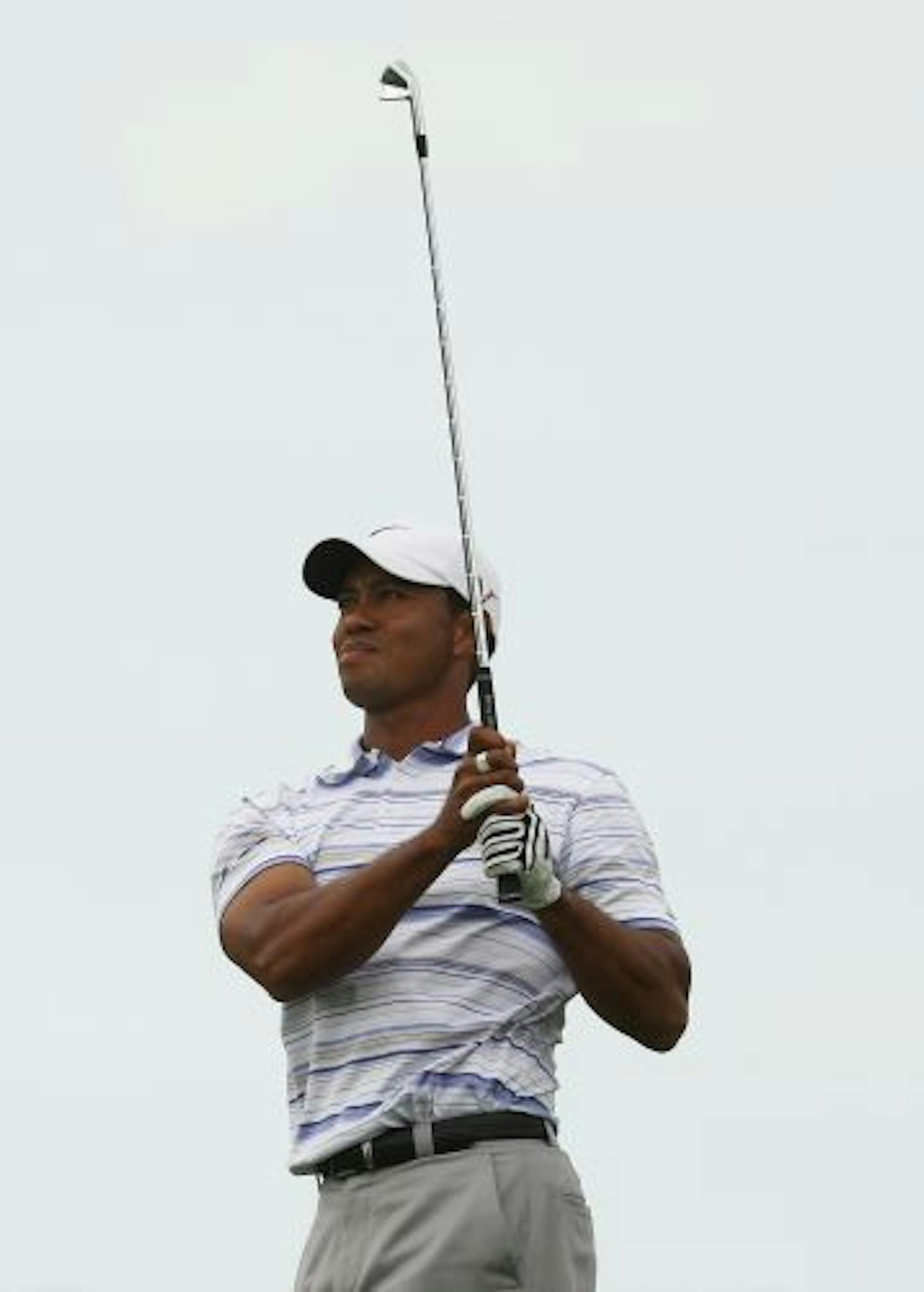 MELBOURNE, AUSTRALIA - NOVEMBER 14: Tiger Woods of the USA plays an approach shot on the 16th hole during round three of the 2009 Australian Masters at Kingston Heath Golf Club on November 14, 2009 in Melbourne, Australia.