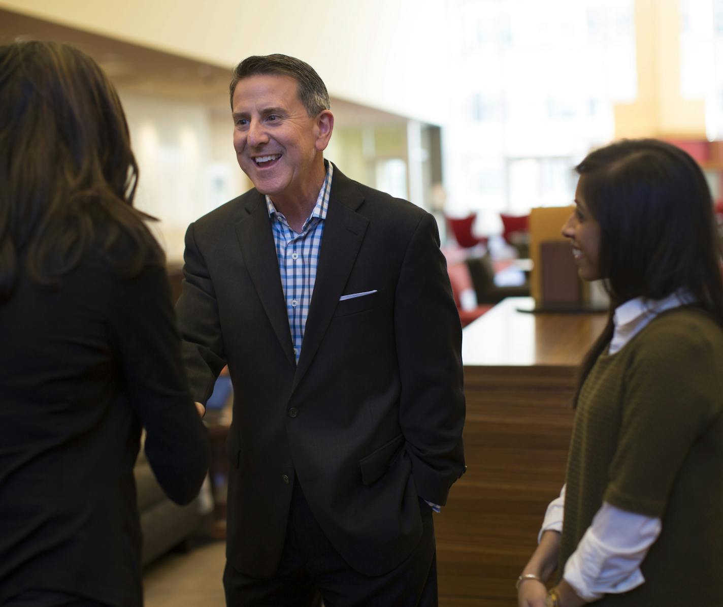 Target CEO Brian Cornell greet employees Rina Hurst (senior buyer) and Anishaa Janardan Janardan (senior business analyst) in the great room at Target headquarters on Thursday, February 26, 2015 in downtown Minneapolis, Minn. ] RENEE JONES SCHNEIDER &#x2022; reneejones@startribune.com