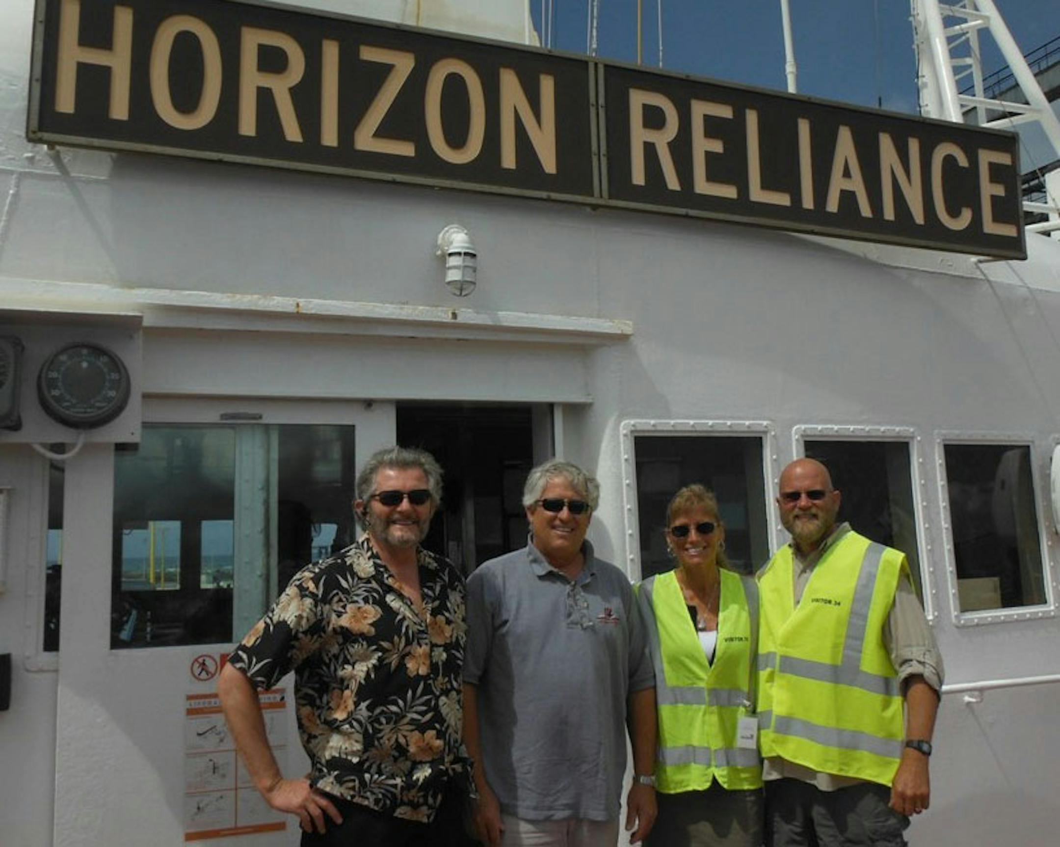From left: Captain Barry Costanzi, an unidentified Horizon Reliance crewmember, and Jenni and John Bourdon.