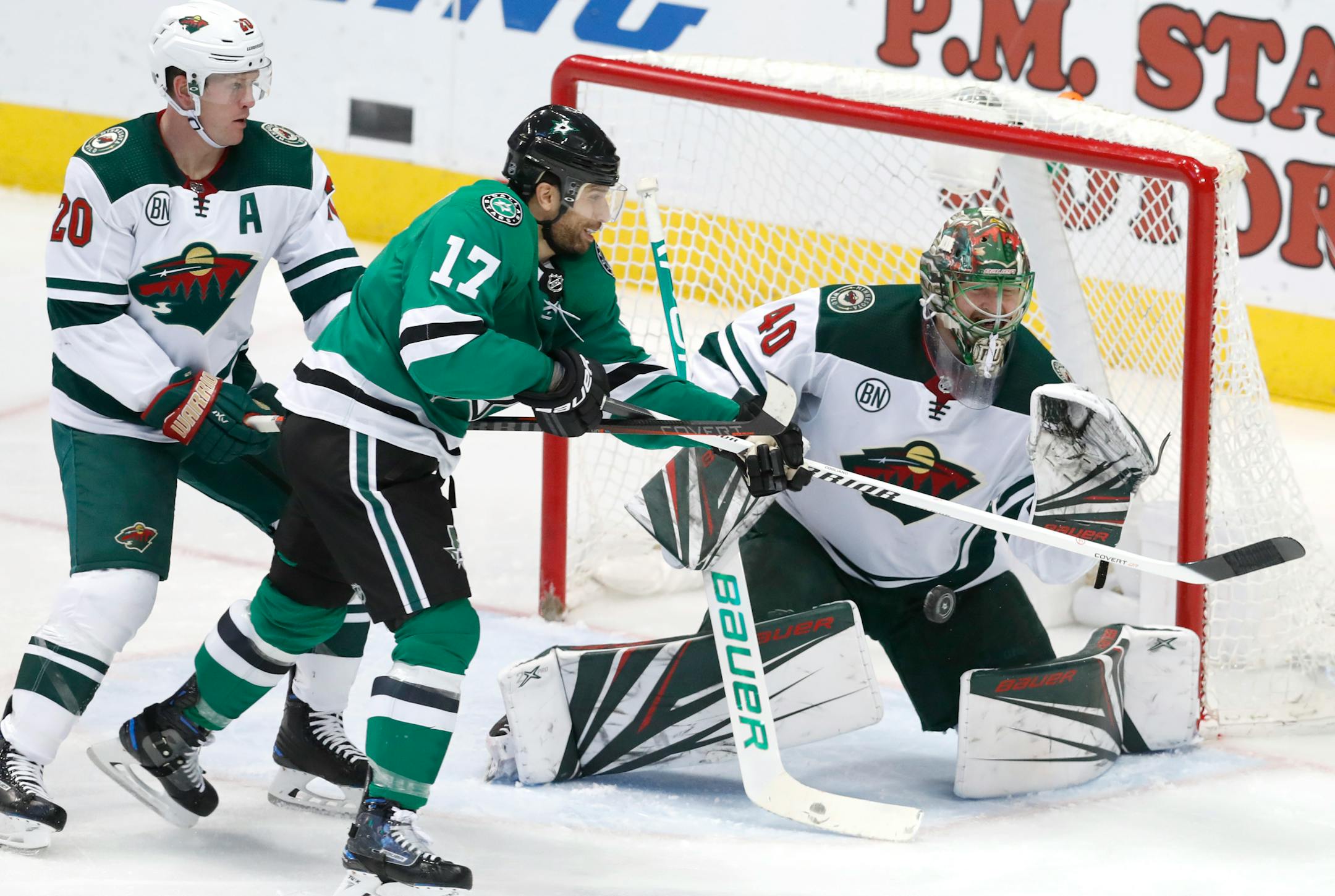 Dallas Stars center Andrew Cogliano (17) scores a goal against Minnesota Wild goaltender Devan Dubnyk (40) and defenseman Ryan Suter