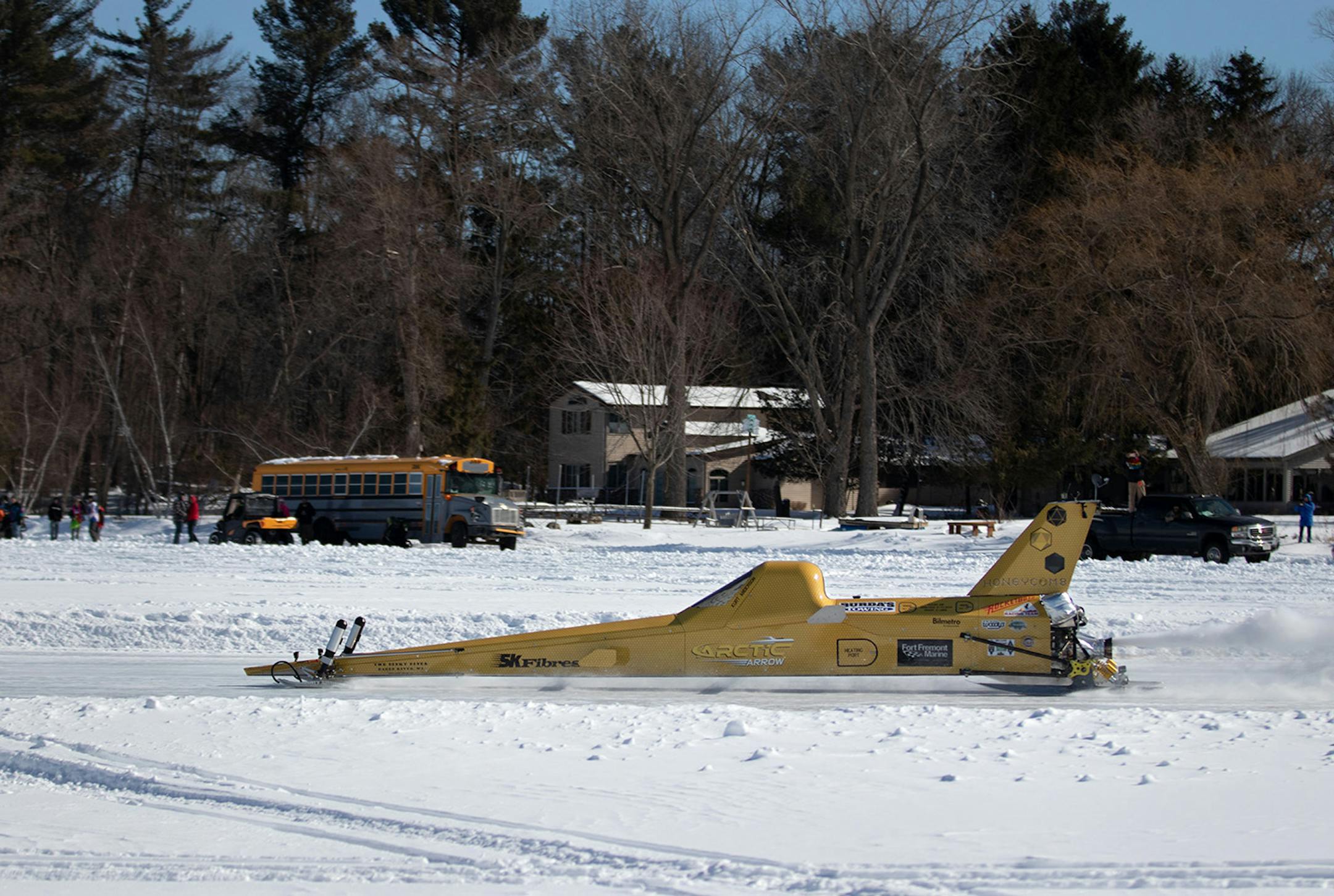 The Arctic Arrow, driven by Kurt Anderson, makes its first run as spectators line the edge of Bear Lake in Manawa, WI on Sunday, Feb. 16, 2020.