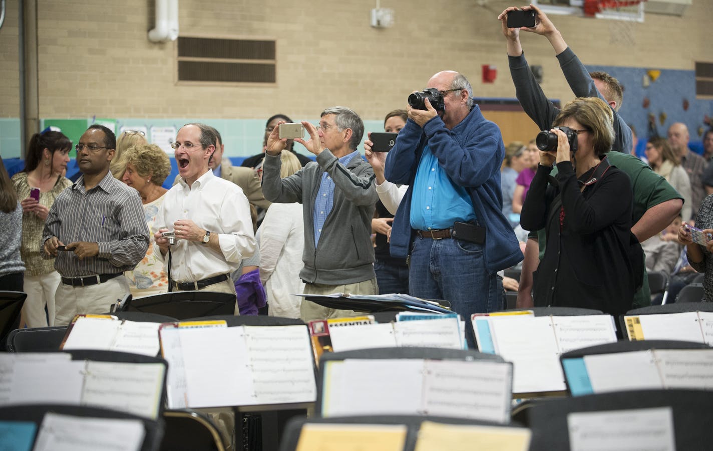 Parents of Kay Hawley's students took photos of Kay with their kids after Tuesday night's concert. ] (Aaron Lavinsky | StarTribune) aaron.lavinsky@startribune.com Kay Hawley, a Hopkins music teacher, is retiring after 42 years. Recently, the district invited back some of her former students for a concert to give her a Mr. Holland's Opus type send off. The concert was held Tuesday, May 5, 2015 at Glen Lake Elementary in Minnetonka.