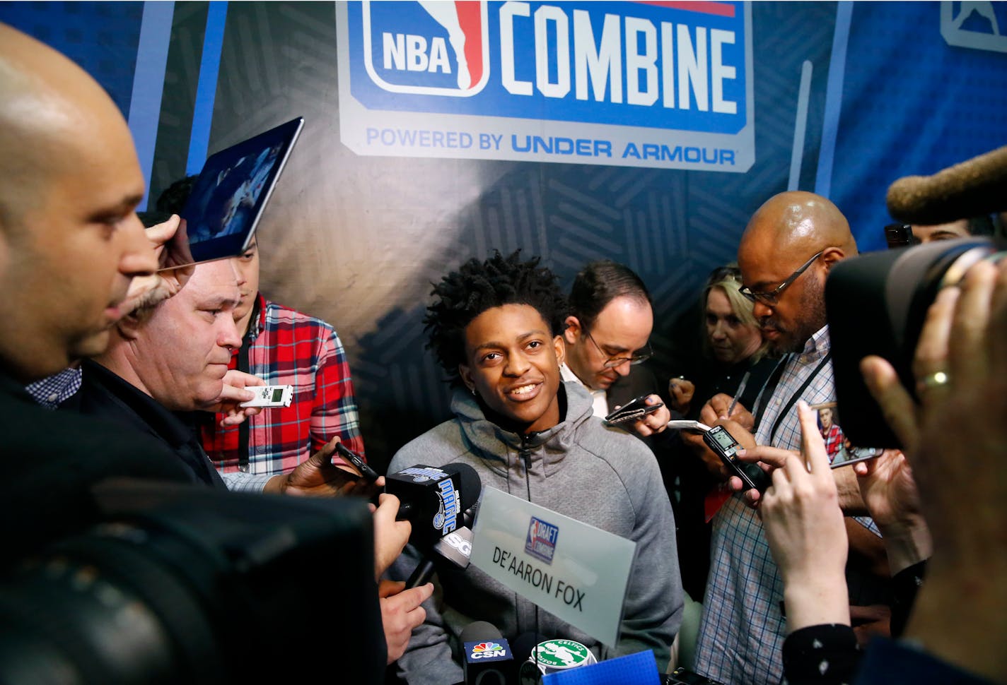 De'Aaron Fox, center, from Kentucky, listens to a question at the NBA draft basketball combine Friday, May 12, 2017, in Chicago. (AP Photo/Charles Rex Arbogast)