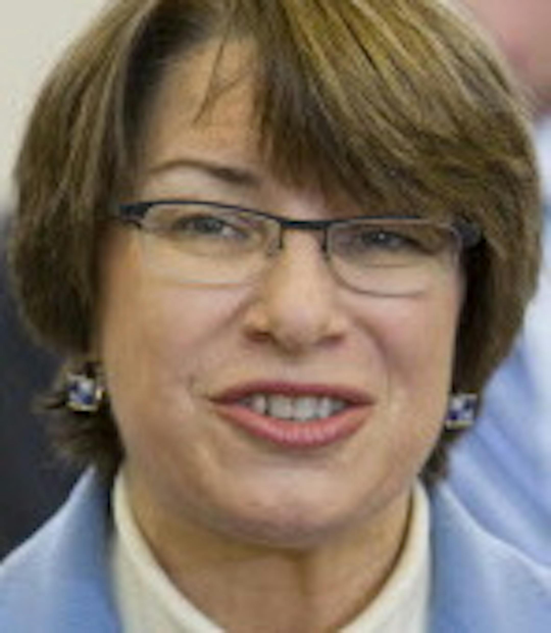 U.S. Senator Amy Klobuchar speaks to guests and media before awarding the Purple Heart to Vietnam veteran Fred Jenness after a 44-year delay at Golden Valley City Hall December 23, 2013. (Courtney Perry/Special to the Star Tribune)