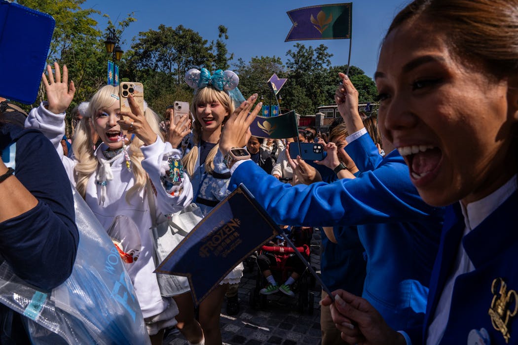 Visitors arrive at the World of Frozen at Disneyland Resort in Hong Kong.