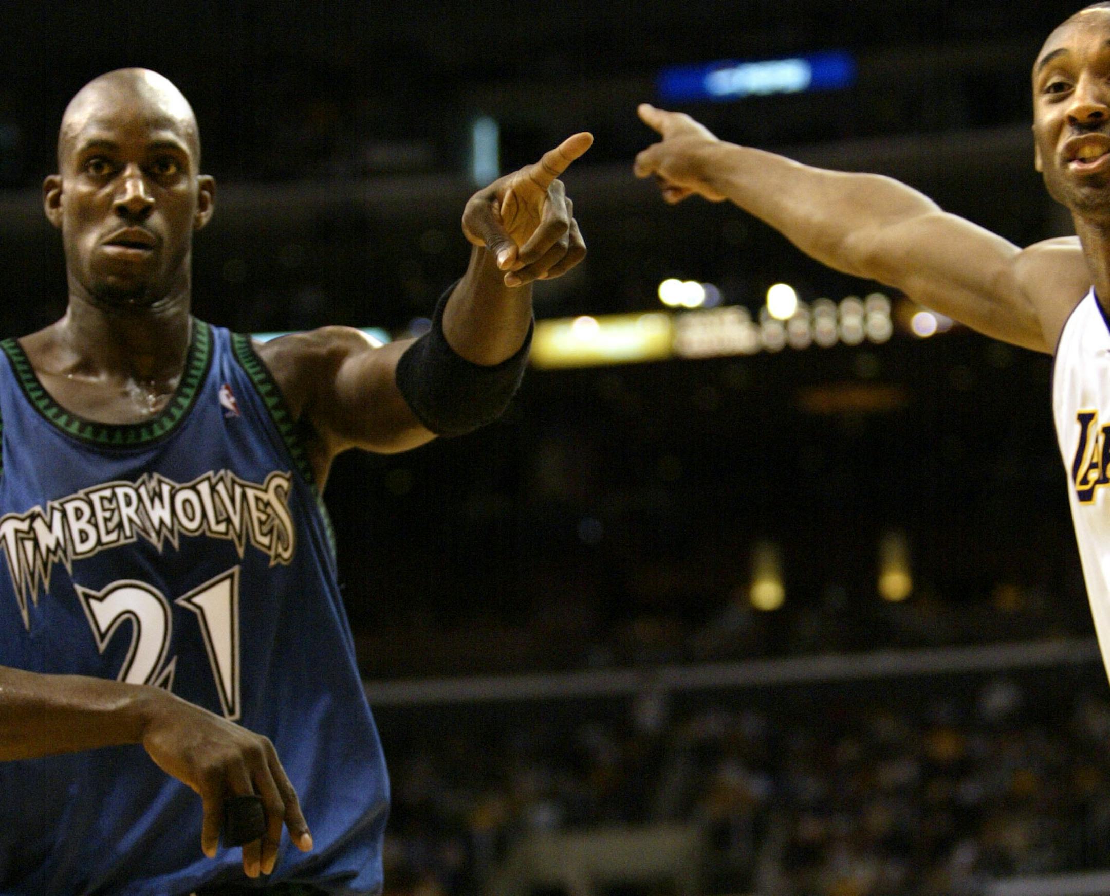 April 27, 2003- Los Angeles, CA- The Staples Center- NBA Playoffs- Minnesota Timberwolves vs. Los Angeles Lakers Minnesota�s Kevin Garnett and LA�s Kobe Bryant give their express a difference in opinion of with a referee over possession of the ball the 1st half of Sunday�s game. LA beat Minnesota by a final score of 102-97 to tie up the series 2-2.