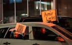 More than 100 cars drove in a car caravan throughout downtown to protest the recent shooting death of Amir Locke by Minneapolis Police on Friday, Feb.
