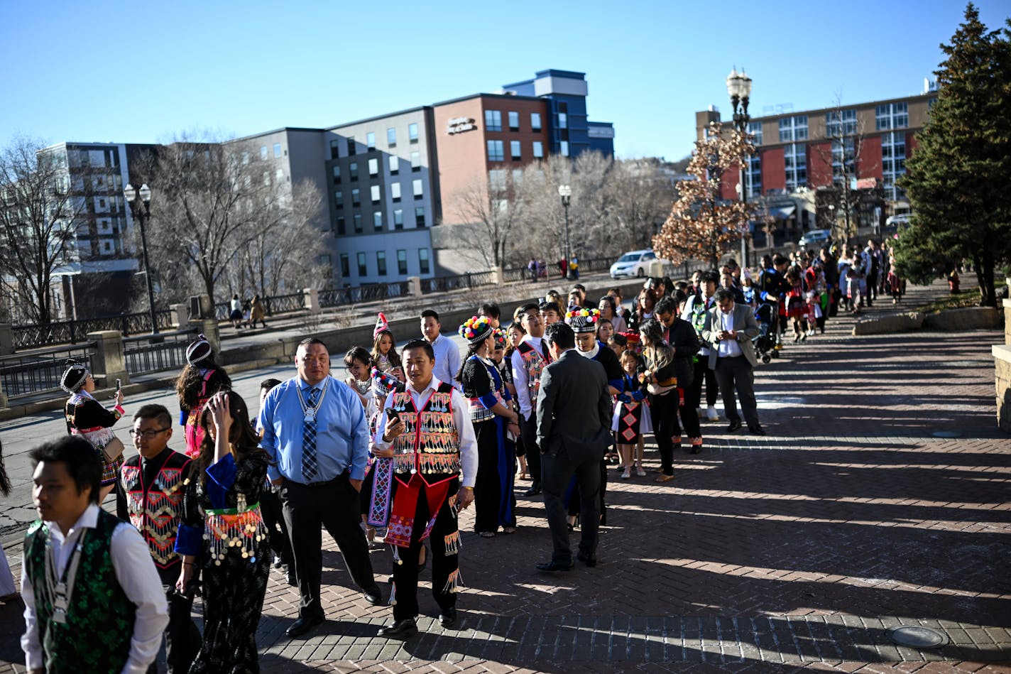 A line for entry stretched around the block around Kellogg Boulevard during the Hmong New Year Celebration Saturday, Nov. 26, 2022 at the St. Paul RiverCentre in St. Paul, Minn... ] AARON LAVINSKY • aaron.lavinsky@startribune.com