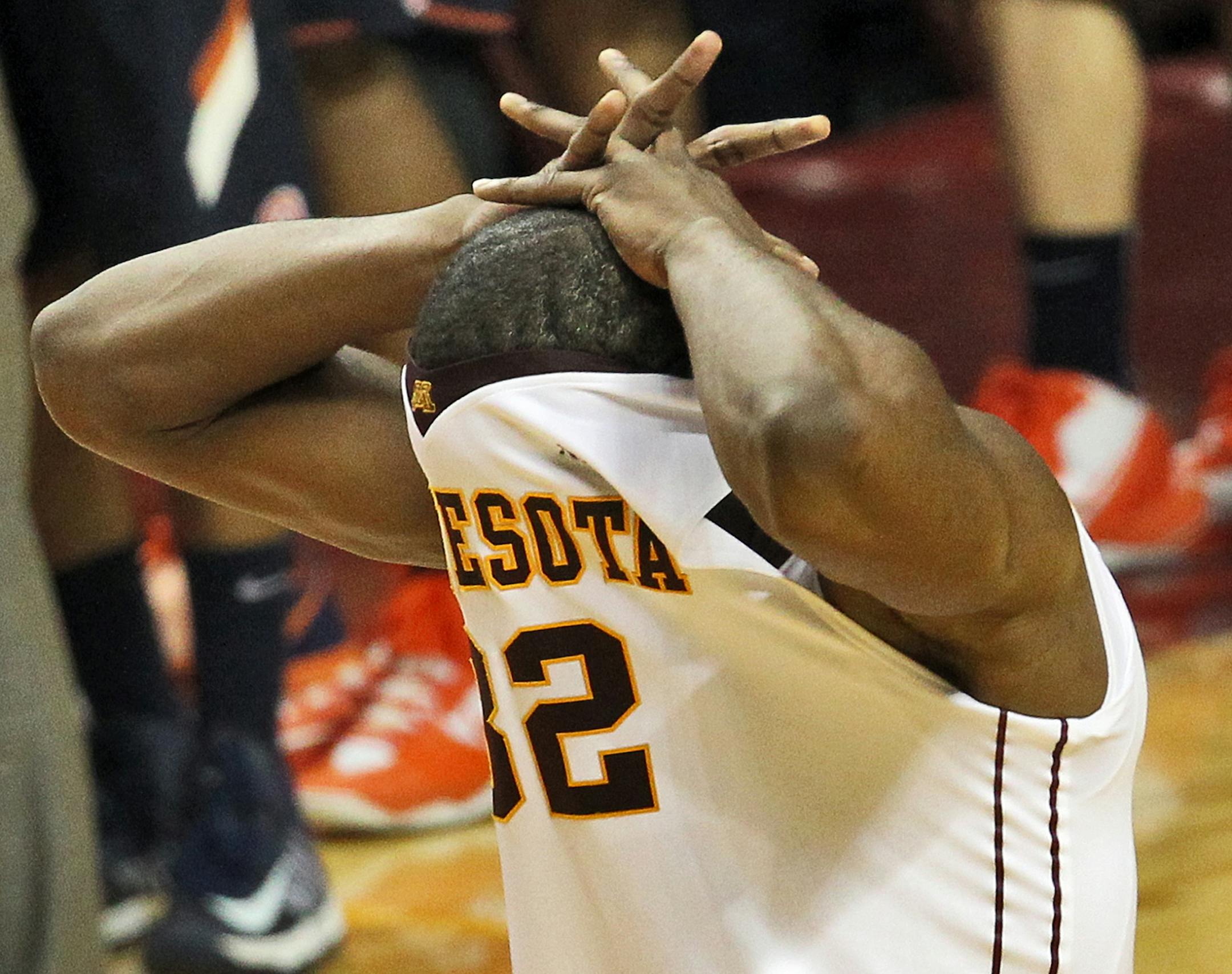 Gophers senior forward Trevor Mbakwe covered his face with his jersey in disappointment Sunday after Illinois defeated the No. 18 Gophers 57-53 at Williams Arena.