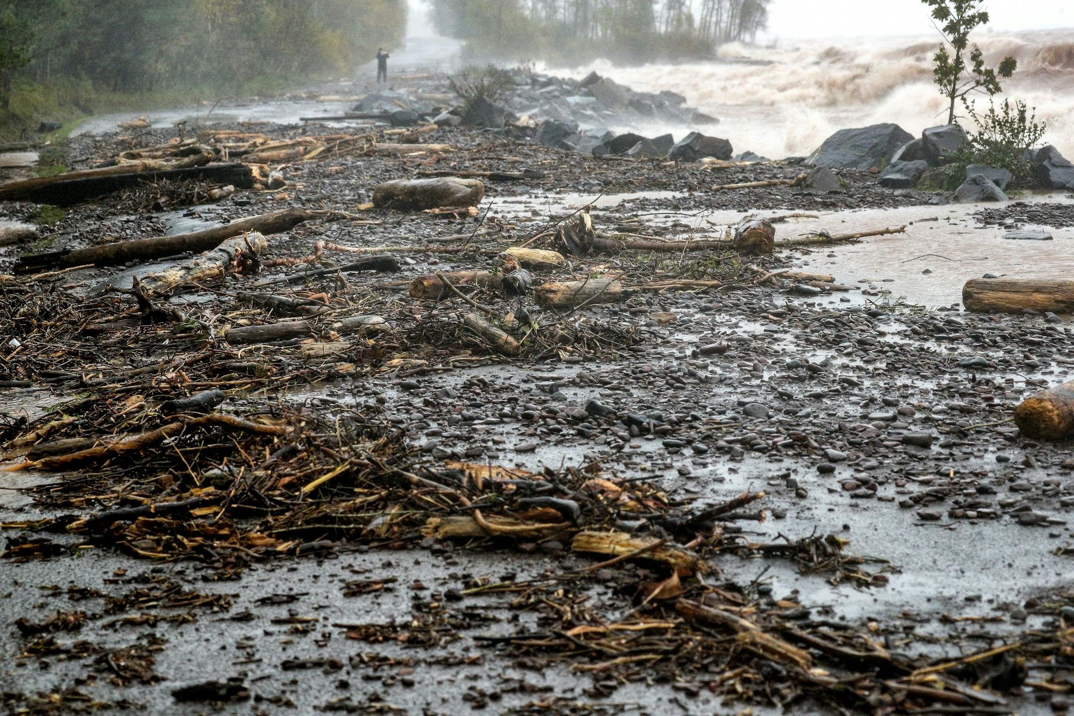 Debris from heavy wave action on Lake Superior at Brighton Beach blocks the road in the park during Wednesday's storm in Duluth. --- Clint Austin / caustin@duluthnews.com