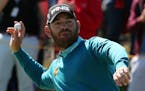South Africa's Louis Oosthuizen celebrates after a hole in one on the 14th green during the first round of the British Open Golf Championship at the R