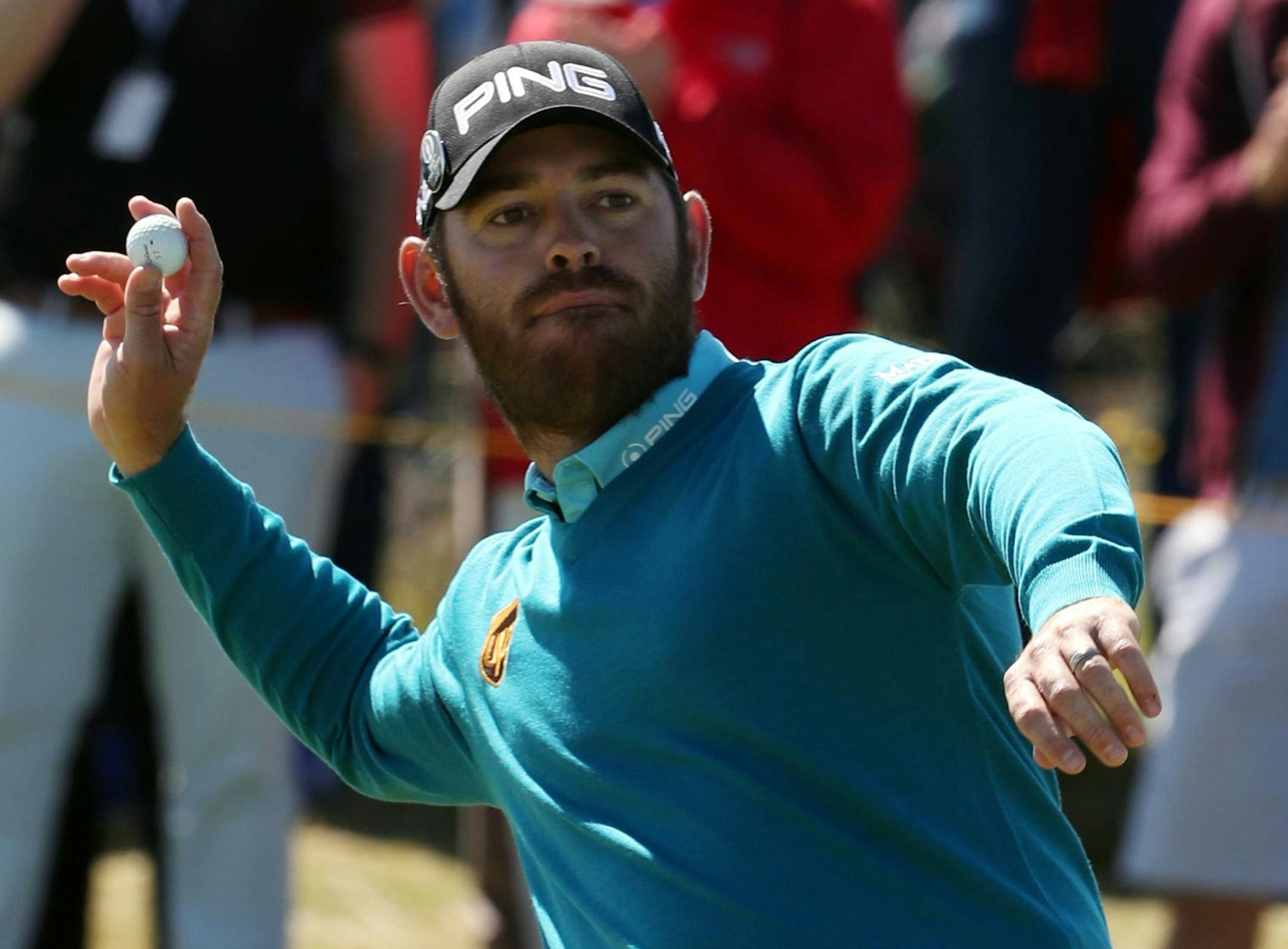 South Africa's Louis Oosthuizen celebrates after a hole in one on the 14th green during the first round of the British Open Golf Championship at the Royal Troon Golf Club in Troon, Scotland, Thursday, July 14, 2016. (Peter Byrne/PA via AP)