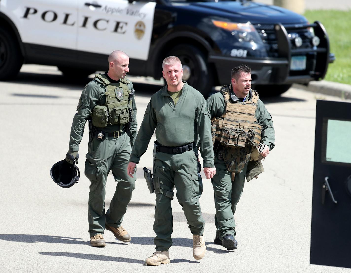 Law enforcement officers prepared to leave the scene following the search for an alleged armed robbery suspect in Mendota Heights on Saturday.