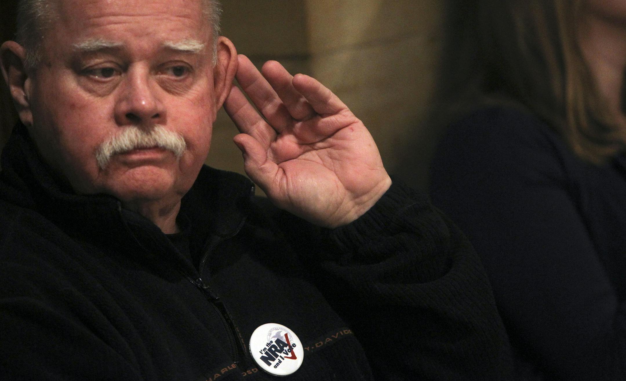 Gun owner Les Hammond of Stillwater, who has some hearing loss, cupped his ear to better hear testifying during hearings on preventing gun violence during testimony Thursday, Feb. 21, 2013, at the State Capitol in St. Paul, MN.] (DAVID JOLES/STARTRIBUNE) djoles@startribune.com Hearings on preventing gun violence resume in Senate. Supporters of gun-rights expected to flood Capitol. Focus of two days of hearings will be on background checks, not gun control, which DFL has taken off the table.**Les