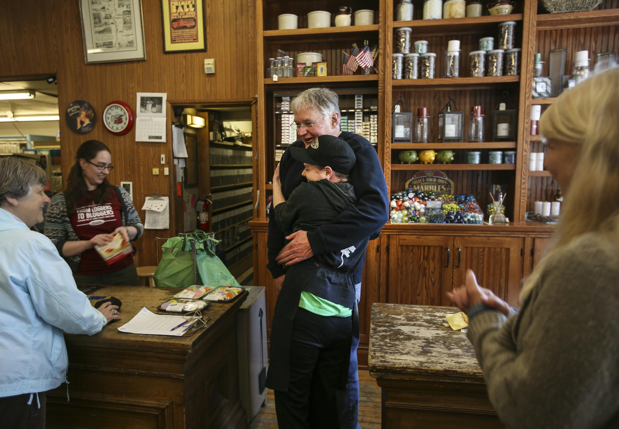Employee Merry Domke hugged owner Andy Kramer as they talked about selling the business at The General Store in Marine on St. Croix, Minn., on Friday, March 27, 2015. ] RENEE JONES SCHNEIDER • reneejones@startribune.com