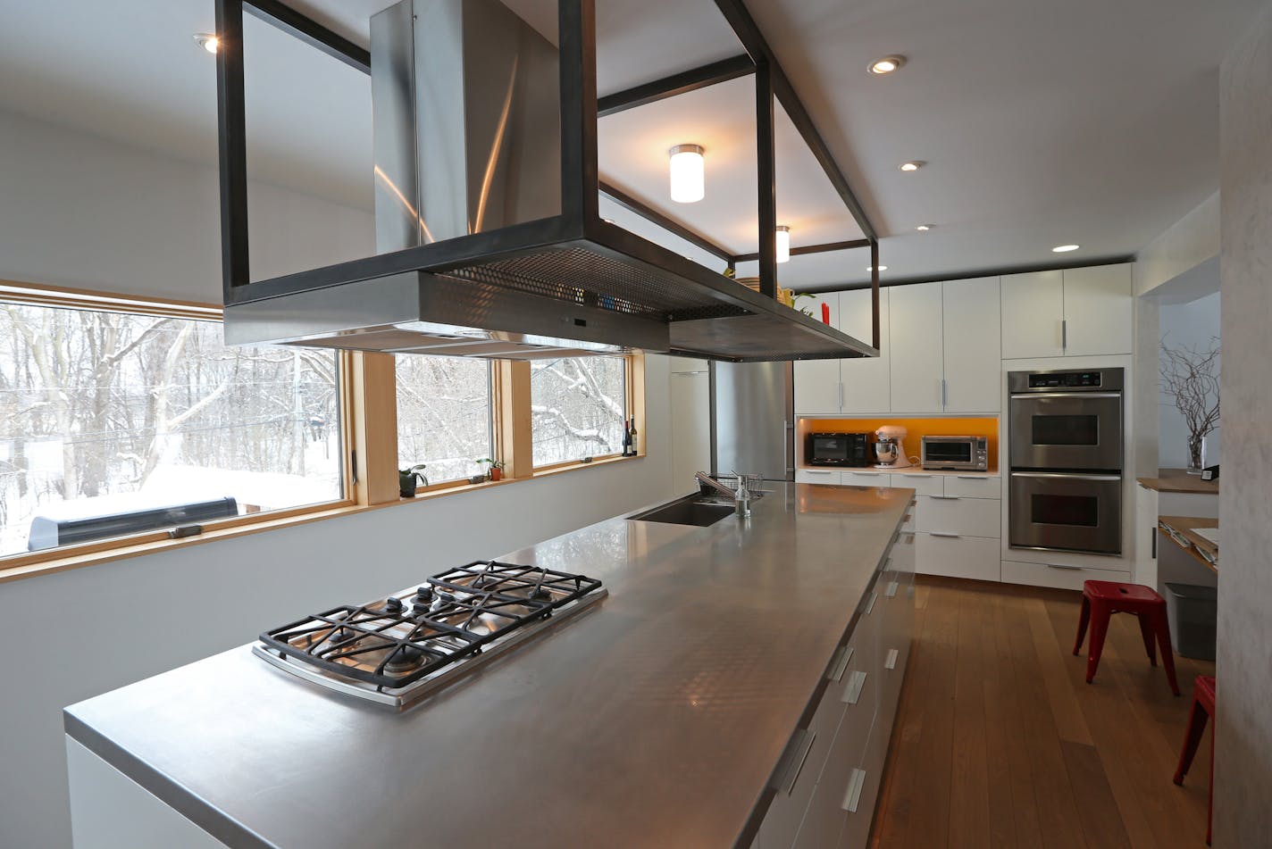 Updated kitchen in the St. Louis Park home of Steve Etzell and Robyn Abear. Photographed on 12/13/13 for a story on the updating of a 1960s compartmentalized home by Geofff Warner, Alchemy Architects.] Bruce Bisping/Star Tribune bbisping@startribune.com Steve Etzell, Robyn Abear/source.