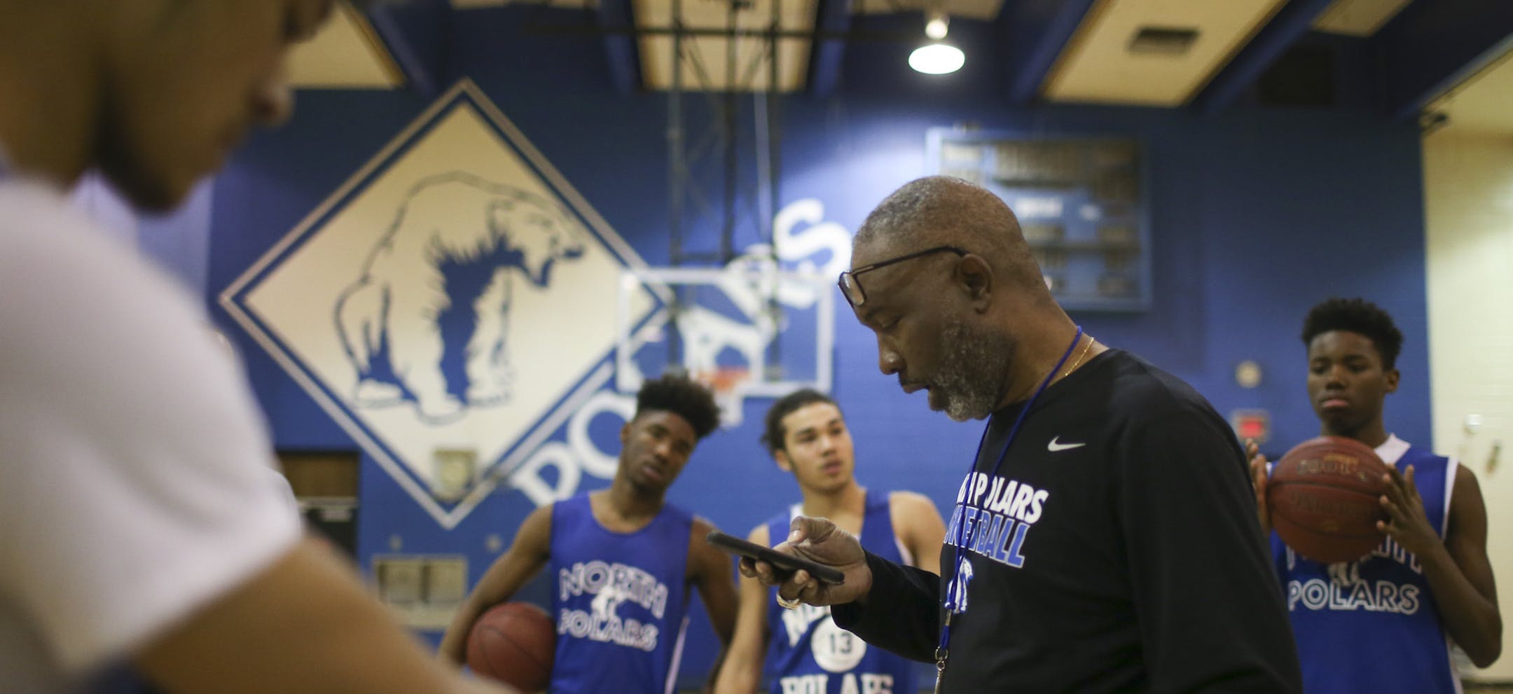 North coach Larry McKenzie read an inspirational quote to his players before the start of practice Tuesday afternoon. The top-seeded Polars take on St. Clair in the opening Class 1A game. (Jeff Wheeler, Star Tribune)