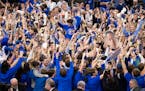 Creighton fans stormed the court following the team's 85-66 win over UConn on Tuesday in Omaha, Neb.