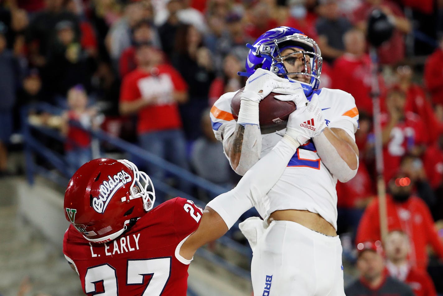 Boise State wide receiver Khalil Shakir, right, catches a touchdown pass against Fresno State defensive back LJ Early during the second half of an NCAA college football game in Fresno, Calif., Saturday, Nov. 6, 2021. (AP Photo/Gary Kazanjian)