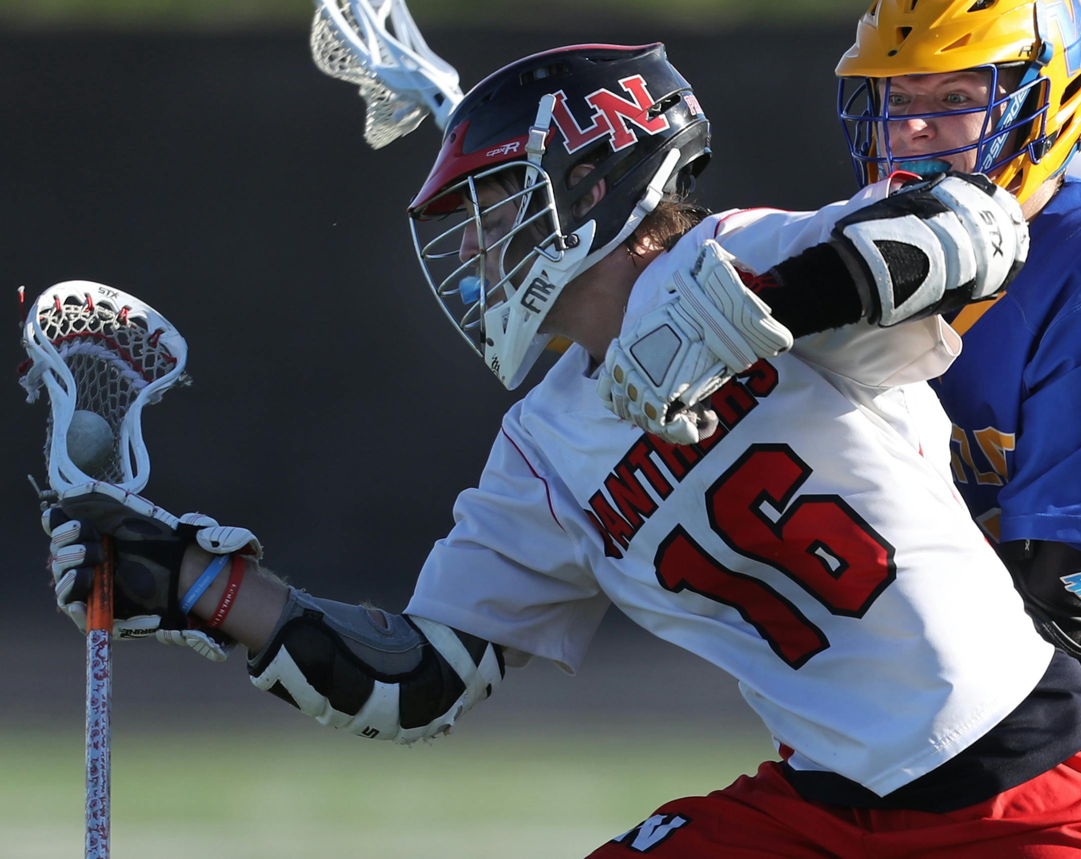 Max Johnson(16) evades Joey Ocholik(1) of Wayzata.[At Chanhassen H.S. in a semifinal lacrosse game between Lakeville North and Wayzata. Richard Tsong-Taatarii/rtsong-taatarii@startribune.com