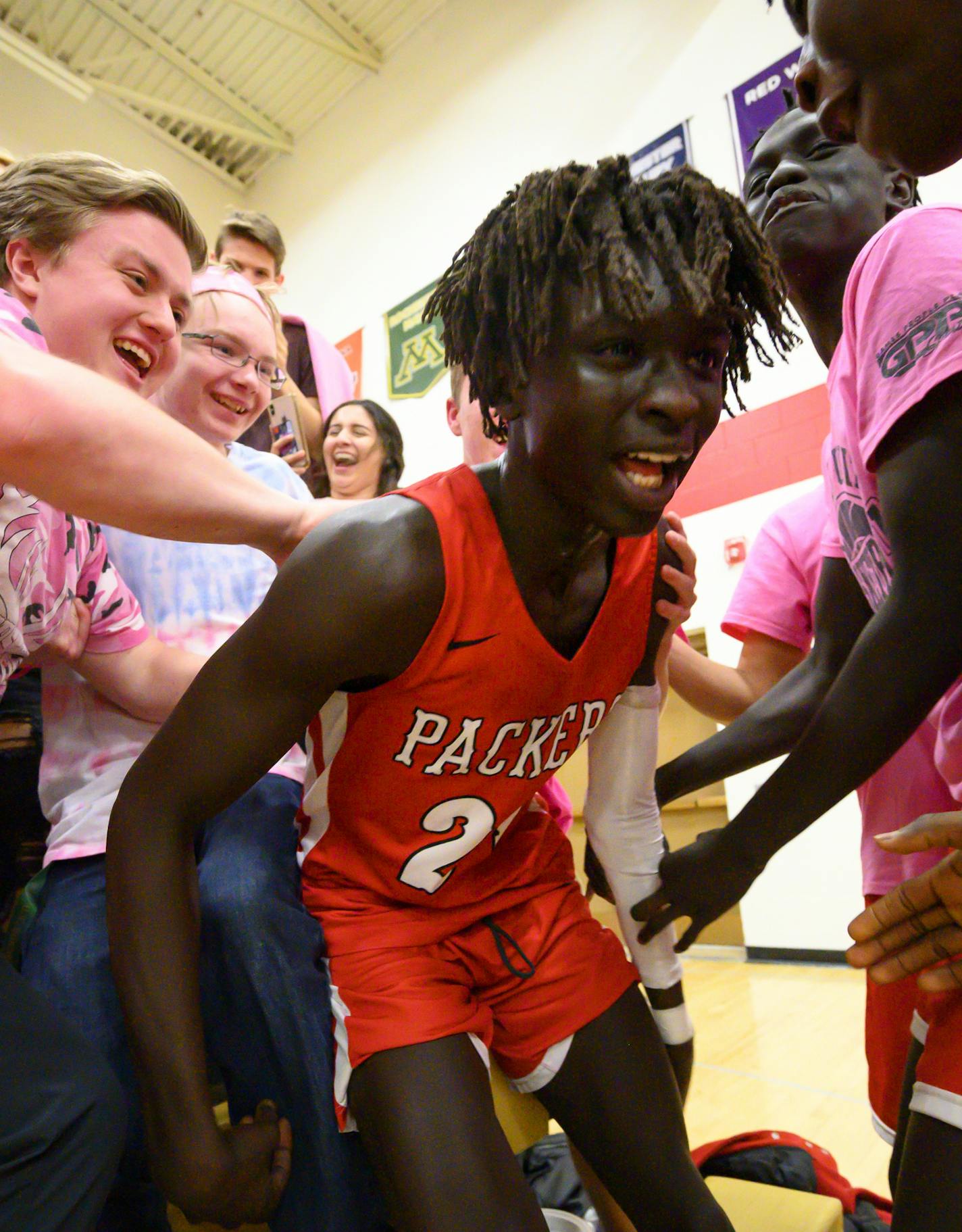 Agwa Nywesh celebrated in the student section after making a last-second basket to win Monday night's game against Mayo. He scored 30 points while wearing Kobe Bryant's No. 24, the day after Bryant was killed with his daughter and seven others in a helicopter crash. ] Aaron Lavinsky &#x2022; aaron.lavinsky@startribune.com Photos to accompany a feature on the ethnic diversification of Austin Minn., as seen through the Austin High School boys basketball and soccer programs, photographed Monday, Ja