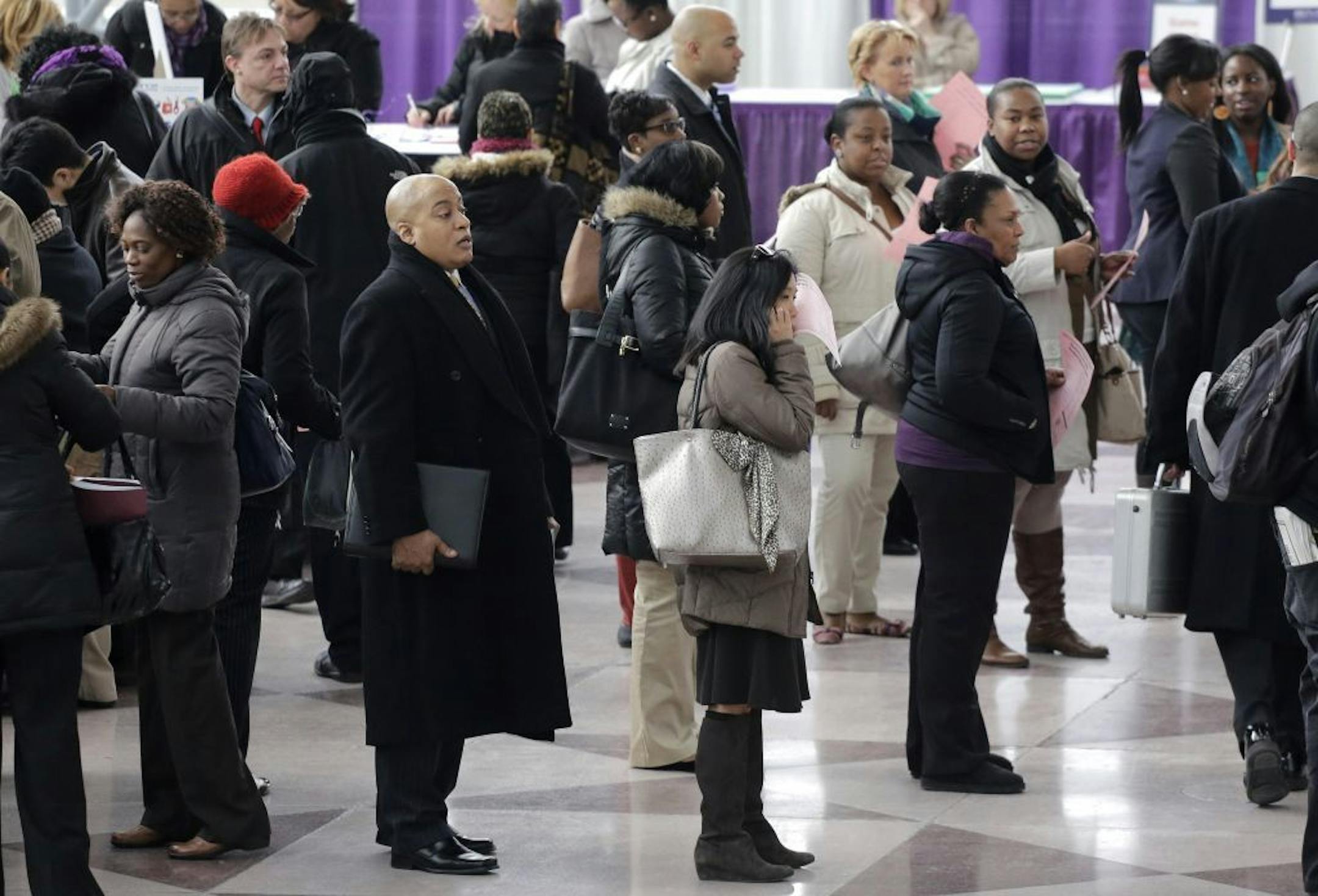 A crowd of job seekers attends a healthcare job fair, Thursday, March 14, 2013 in New York.