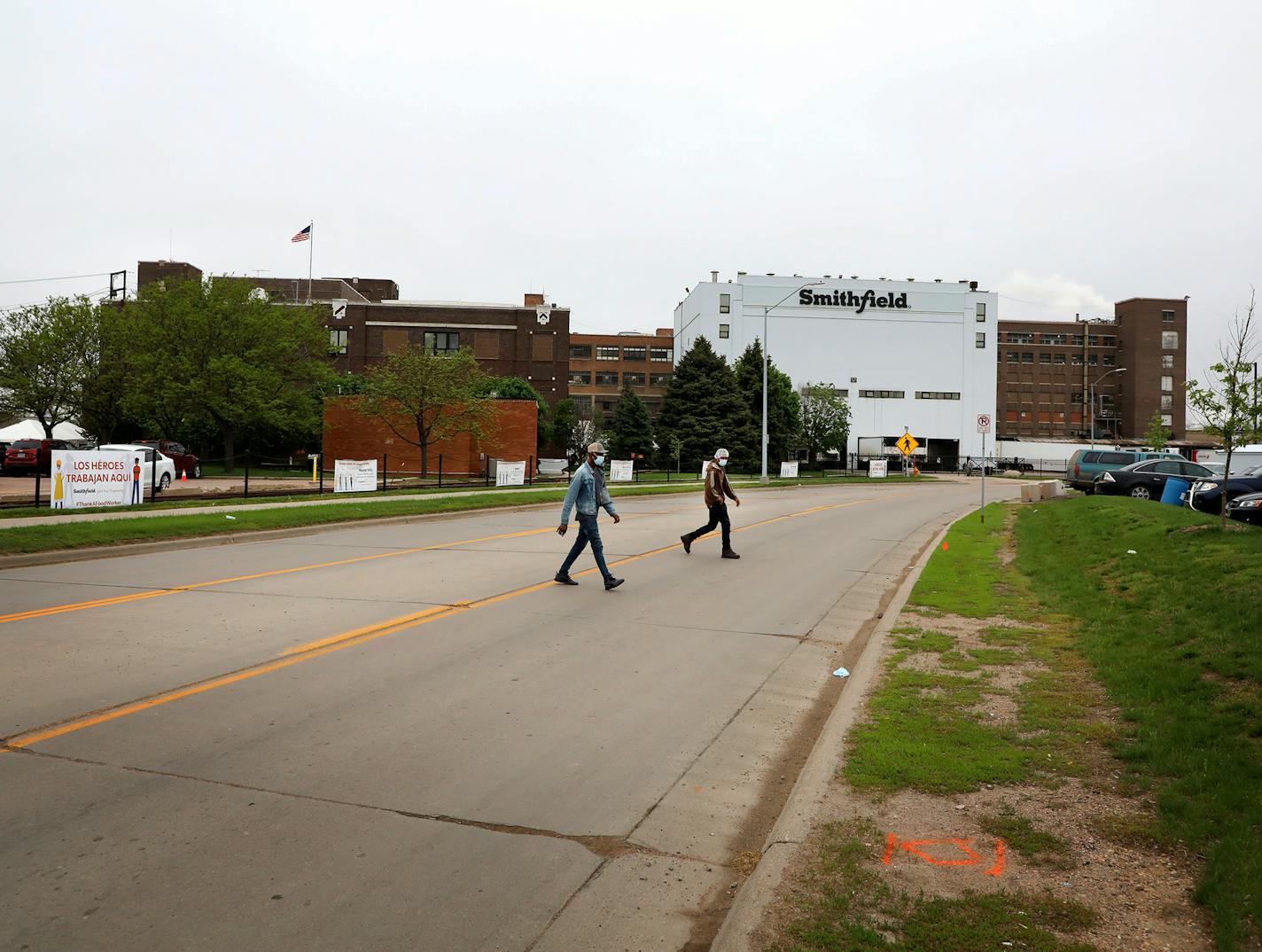 Employees leave work following an overnight shift in May at Smithfield Foods pork processing plant in Sioux Falls, S.D. (DAVID JOLES/Star Tribune)